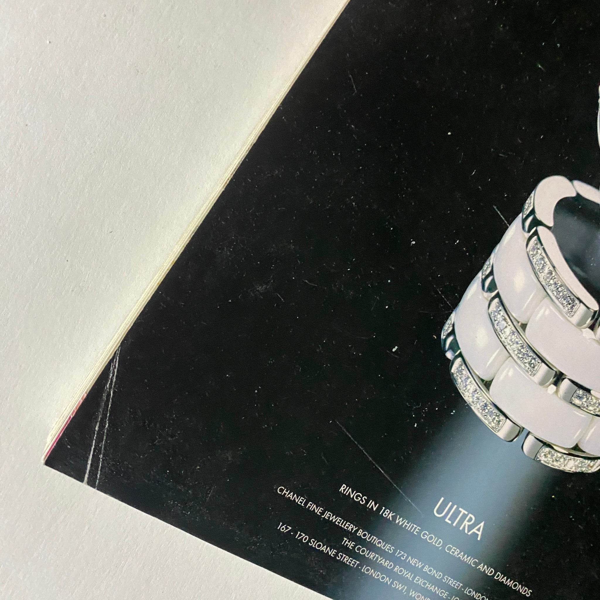 Close-up view of Chanel Fine Jewellery magazine showcasing detailed rings in white gold, ceramic, and diamonds under the title 'ULTRA'.