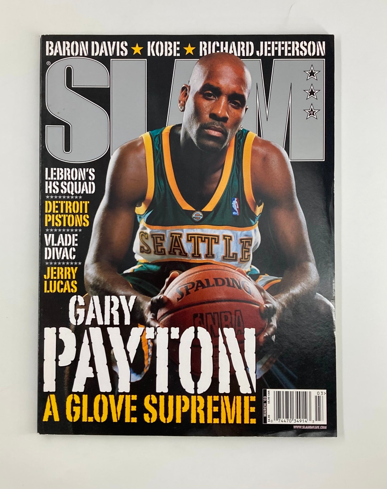 Slam Magazine March 2003 cover featuring Gary Payton of the Seattle Supersonics, showcasing his iconic pose and basketball skills.