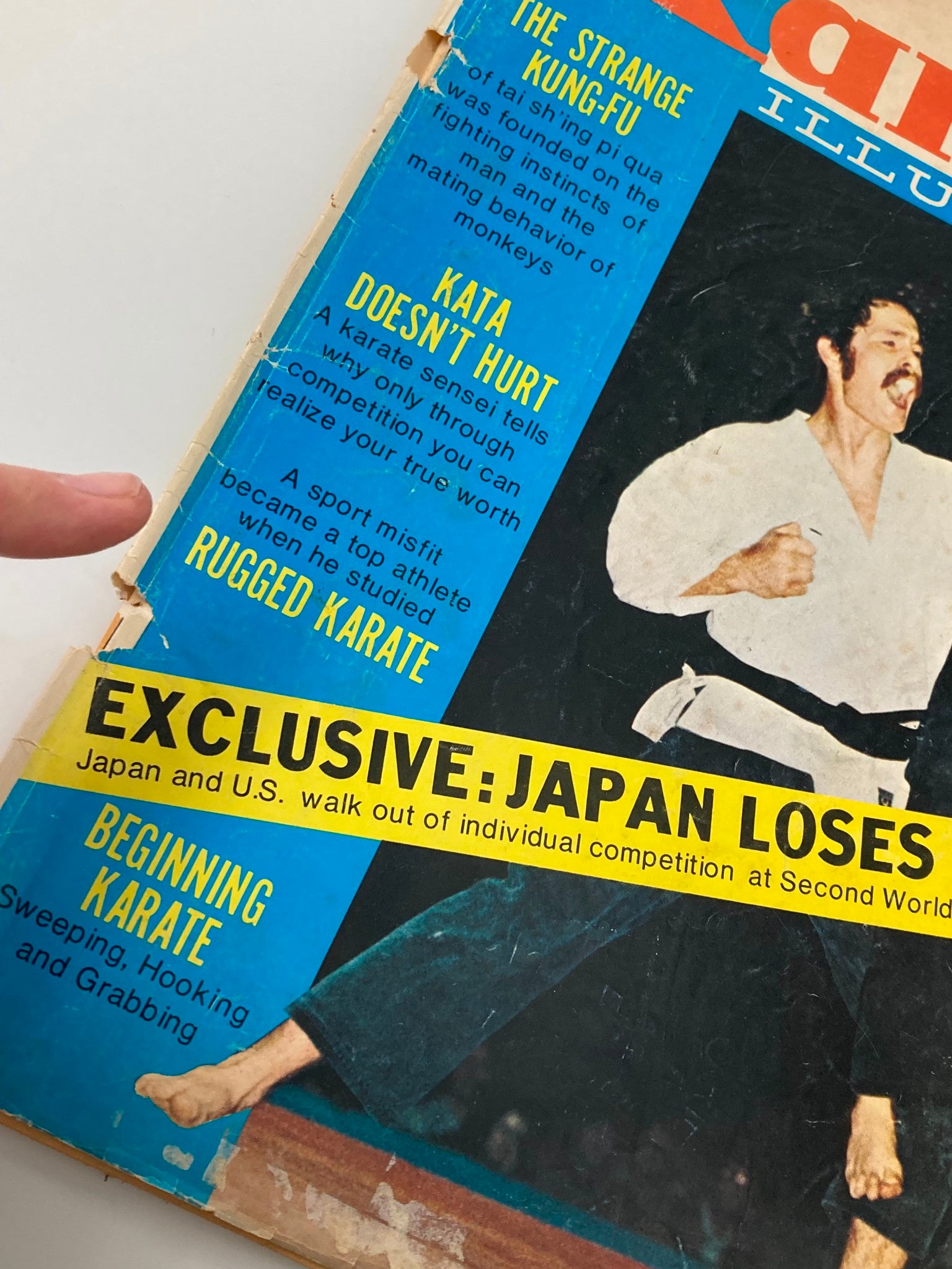 Close-up of the cover of VTG Karate Illustrated Magazine September 1972 showing article titles such as 'Kata Doesn't Hurt' and 'Rugged Karate,' with a focus on the martial arts theme.