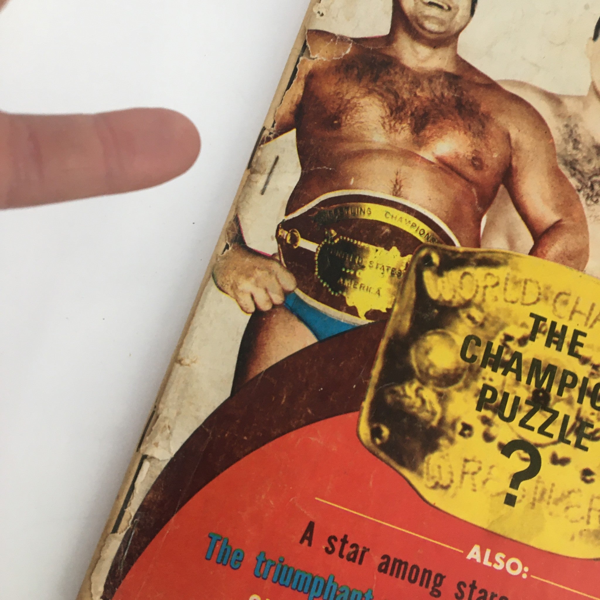 Close-up of the Wrestling Monthly Magazine October 1971 cover showing Fred Blassie with the championship belt. The cover highlights wrestling topics including a champion puzzle and notable wrestlers of the era.