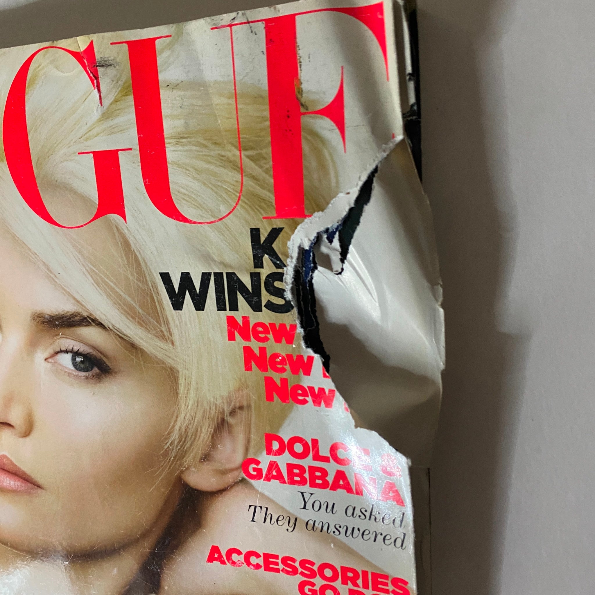 Cover of Vogue Magazine April 2011 featuring Kate Winslet, showing significant wear and tear.