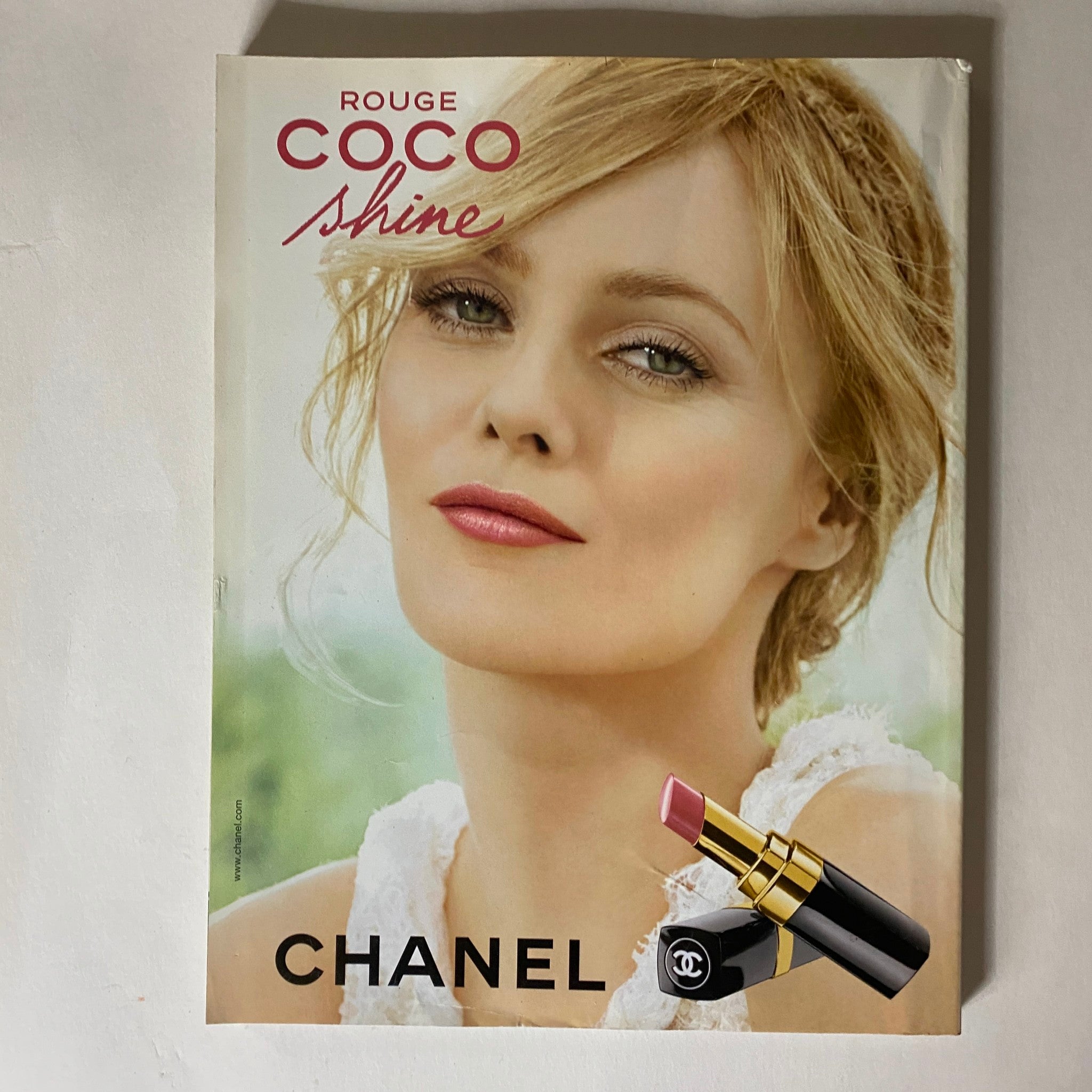 Chanel advertisement featuring a lipstick product and a model, displayed in Vogue Magazine April 2011.