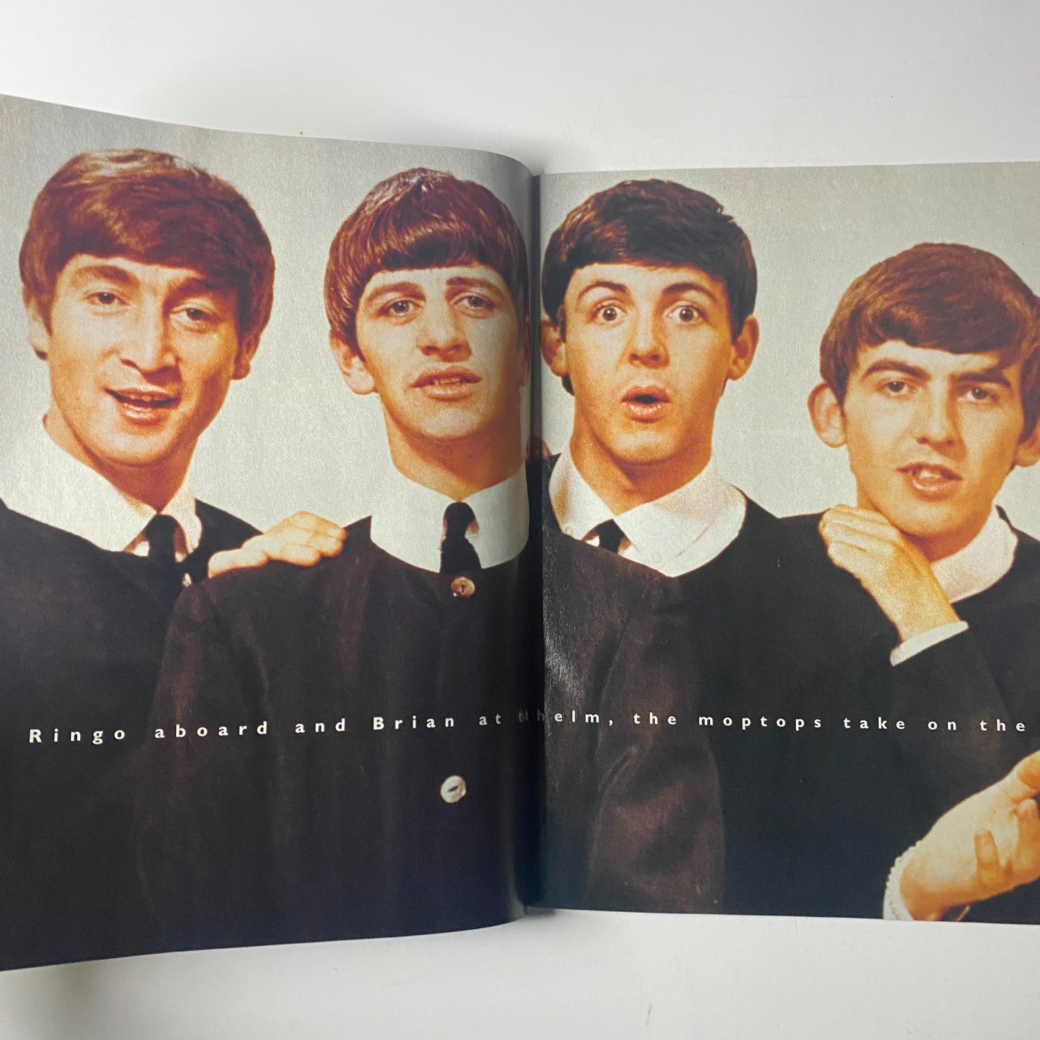 Inside spread of Life Magazine December 1995 The Beatles Reunion Special showcasing The Beatles, including Ringo Starr and Paul McCartney, captured in their iconic suits.