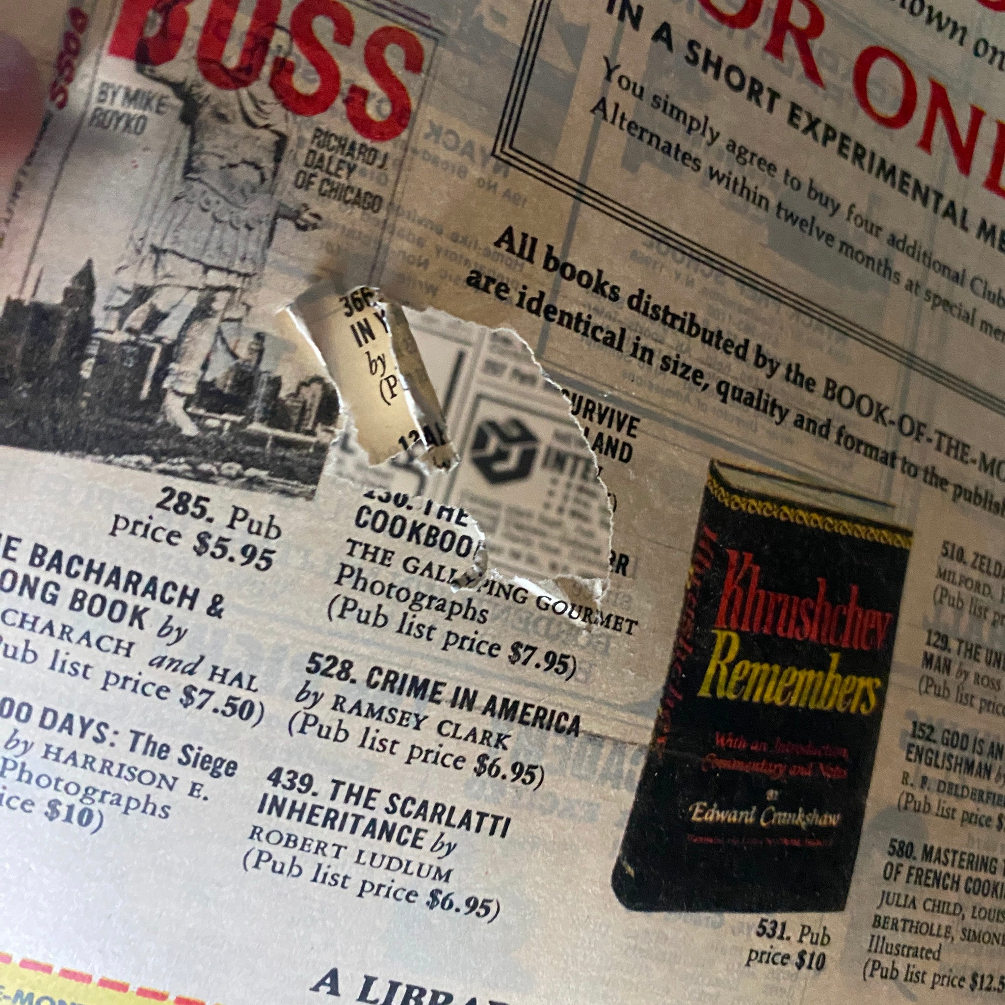 Close-up of an article from the back cover of The New York Times Magazine June 13, 1971 showing a damaged section with book listings and advertisements.