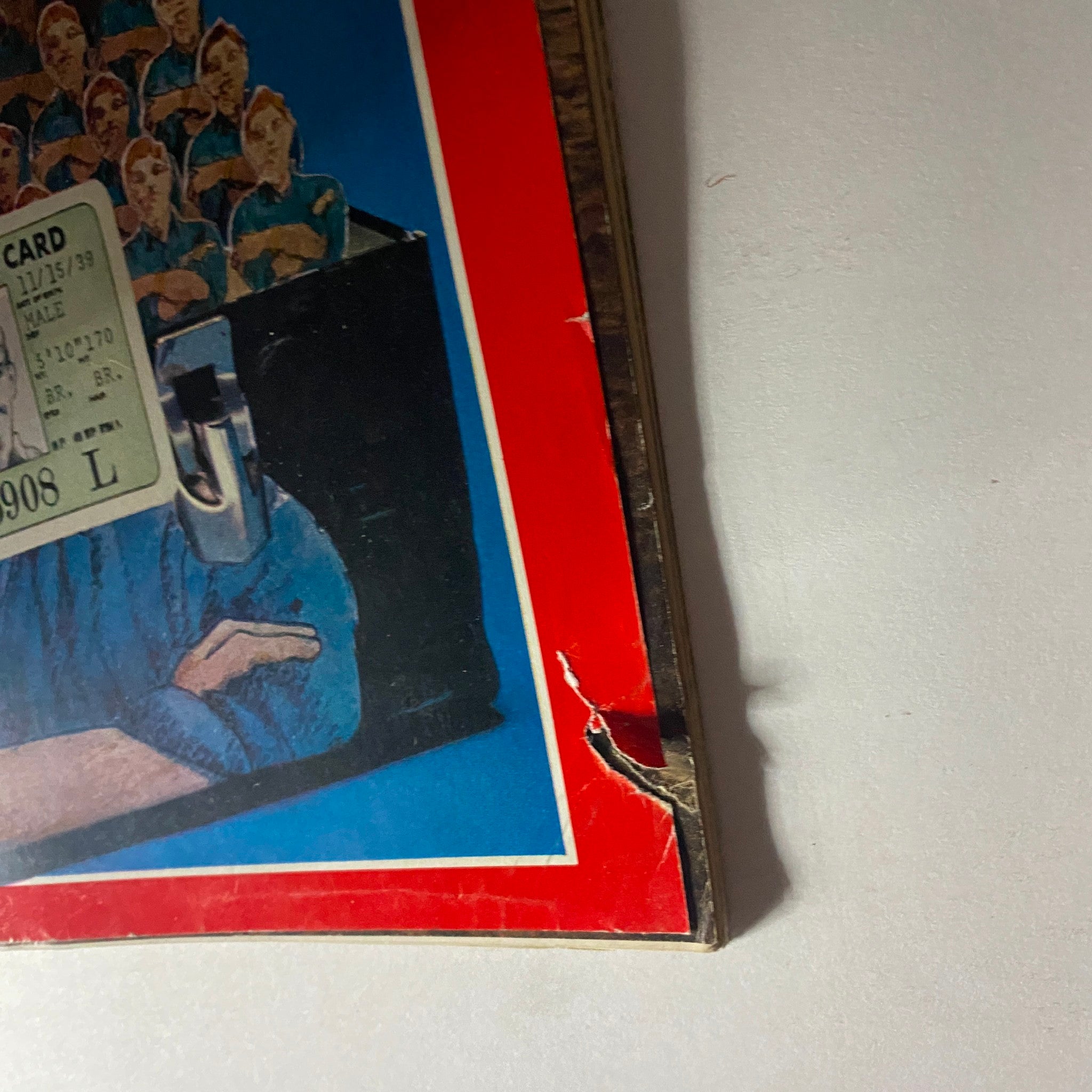Close-up view of the cover of VTG Time Magazine November 9 1970 titled 'Blue Collar Power', highlighting intricate details including an I.D. card and artistic representation of blue-collar workers.