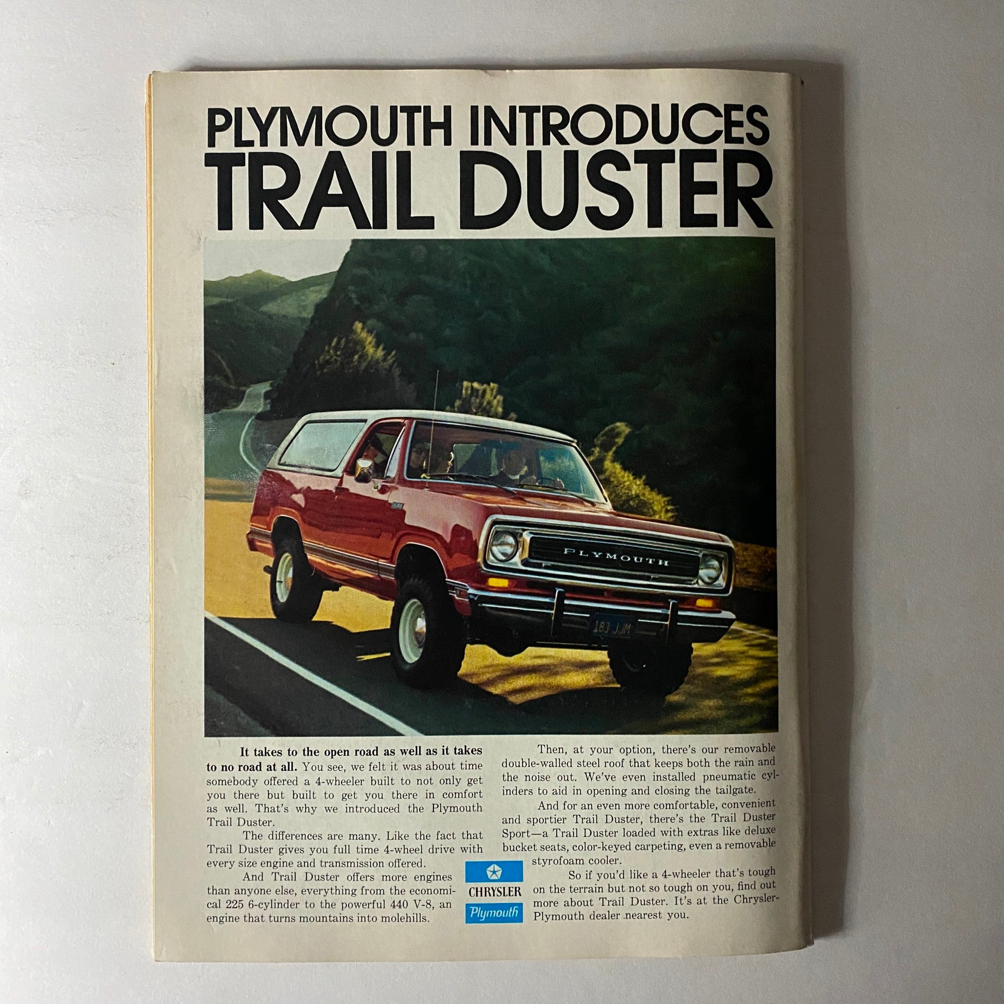 Cover of VTG Pickup, Van & 4WD Magazine January 1975 featuring Plymouth Trail Duster. The magazine showcases a red Plymouth Trail Duster on a scenic road, emphasizing its features and design.