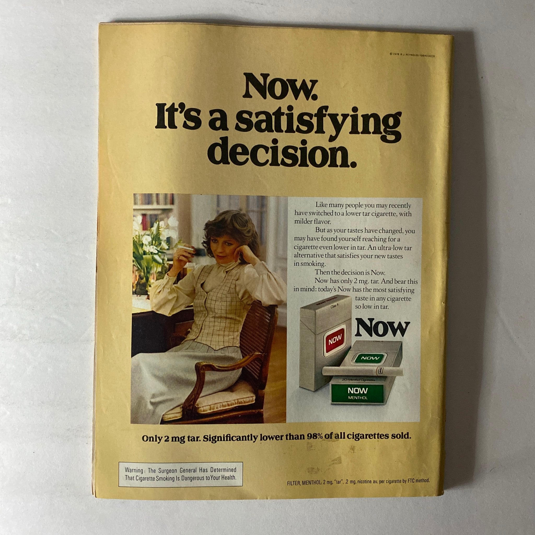 Back cover of the October 2 1978 Newsweek Magazine featuring an advertisement for 'Now' cigarettes with a woman and the tagline 'It's a satisfying decision'.