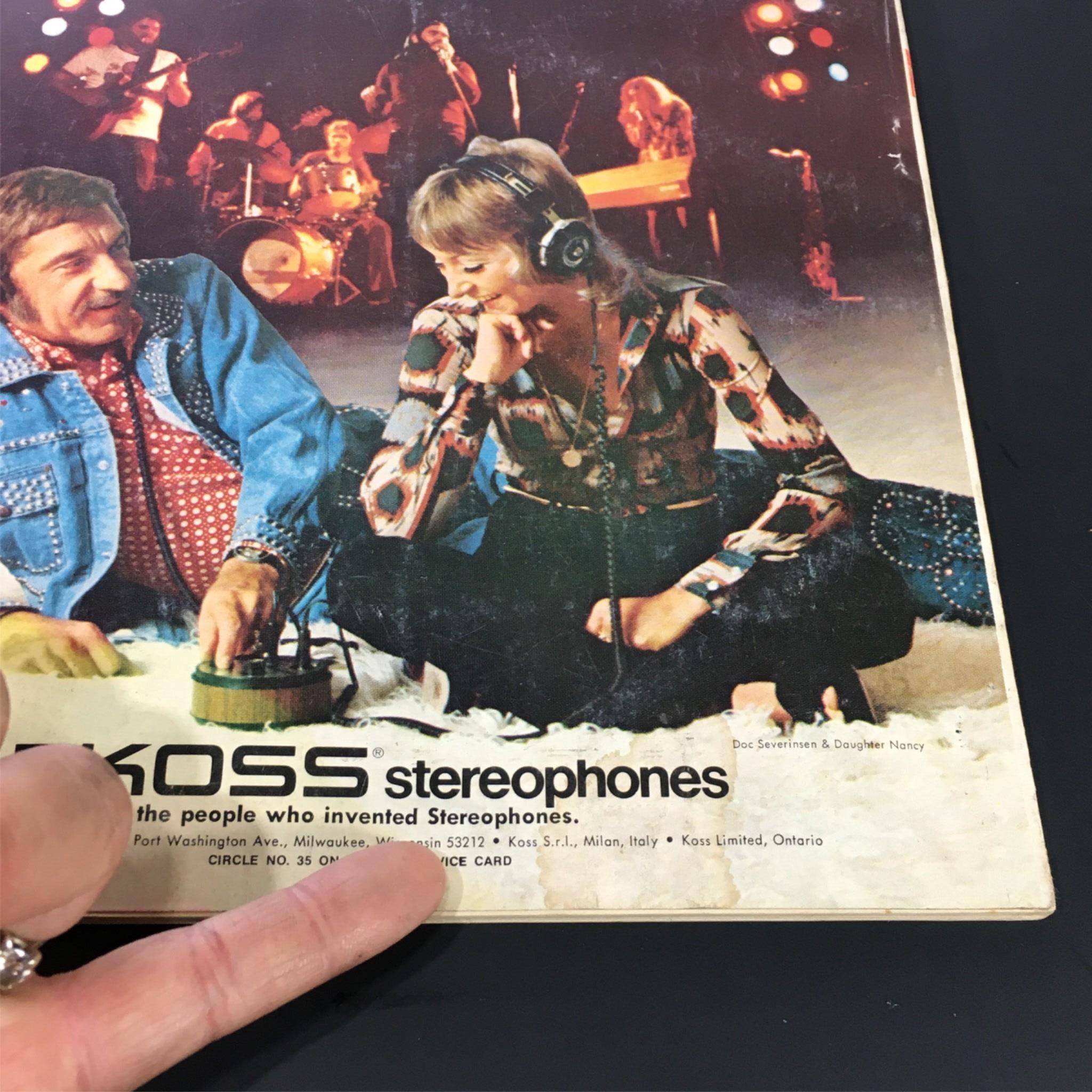 Back cover of Vintage Stereo Review Magazine November 1974 showcasing a Koss stereophones advertisement, depicting a man and woman enjoying music together.