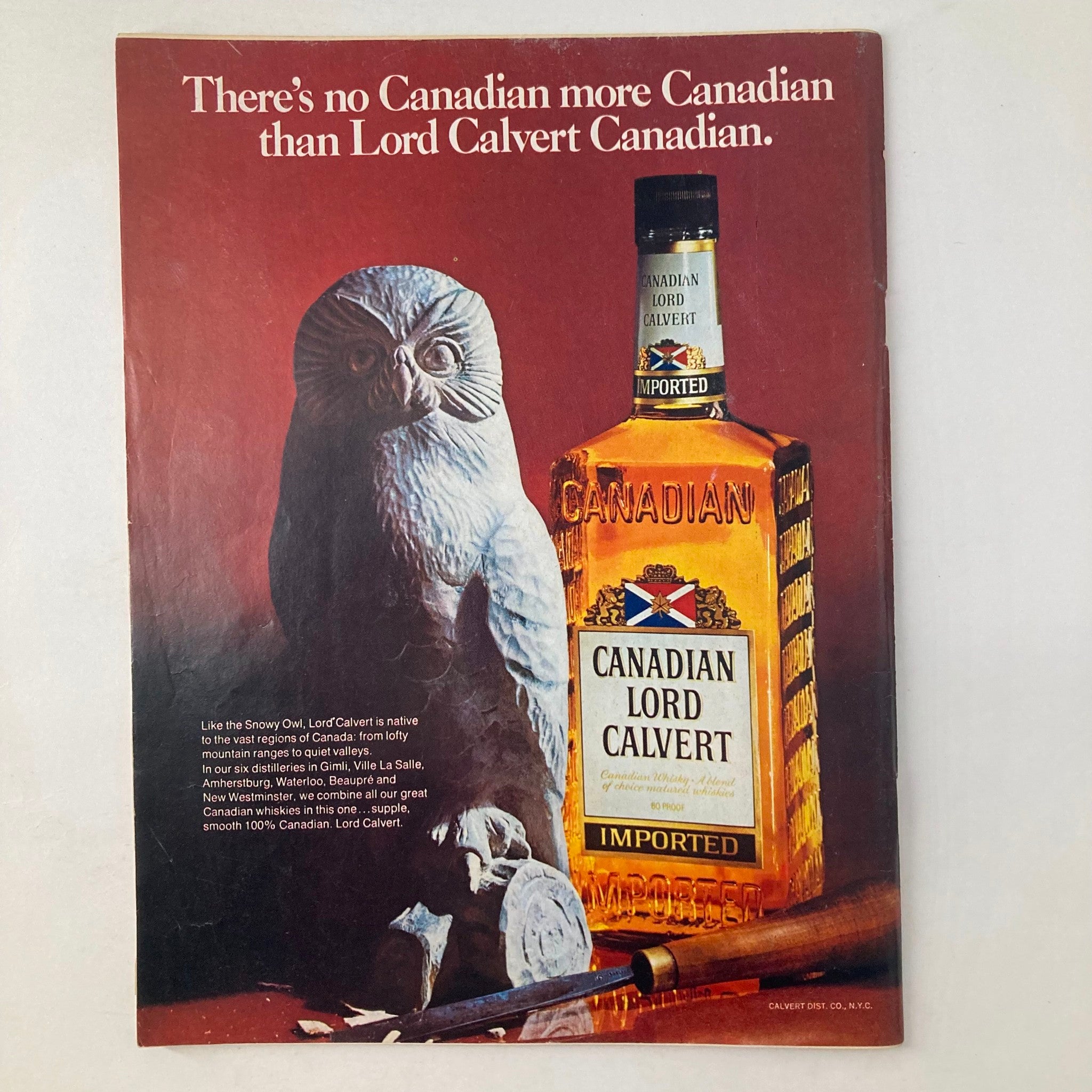 Advert for Canadian Lord Calvert whiskey from the vintage Newsweek Magazine dated May 26, 1975, showcasing a bottle next to a decorative snowy owl sculpture.