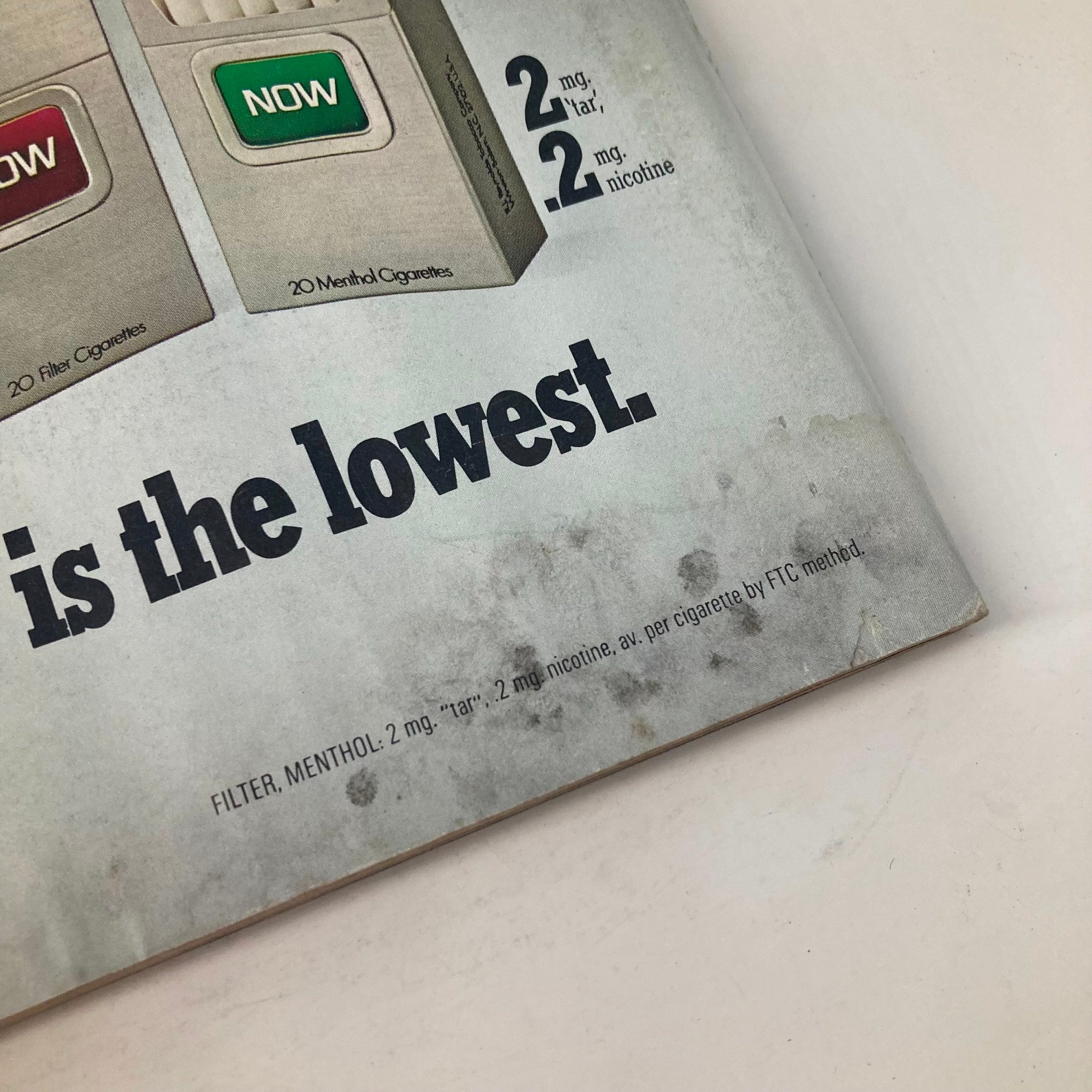 Vintage advertisement in the March 1976 issue of Los Angeles Magazine featuring a cigarette package showcasing menthol filters with low tar and nicotine content, relevant to the Dinah Shore issue.