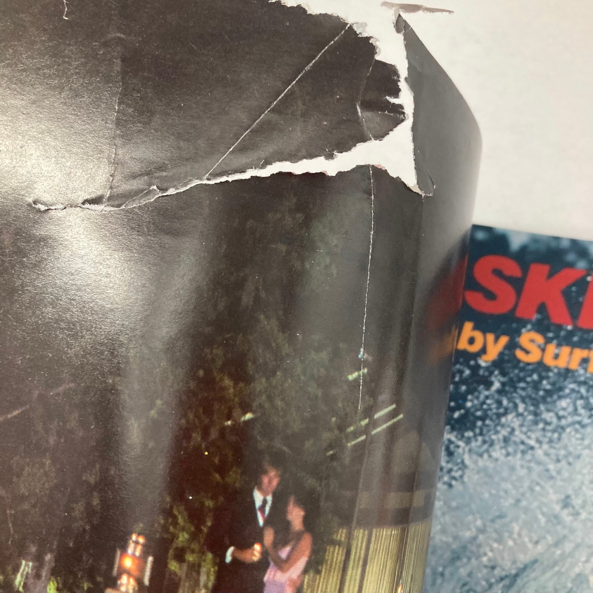 Image showing a partially torn section of Spray The Water Skiing Magazine Winter 1977, with a black and white photograph and text from the magazine.