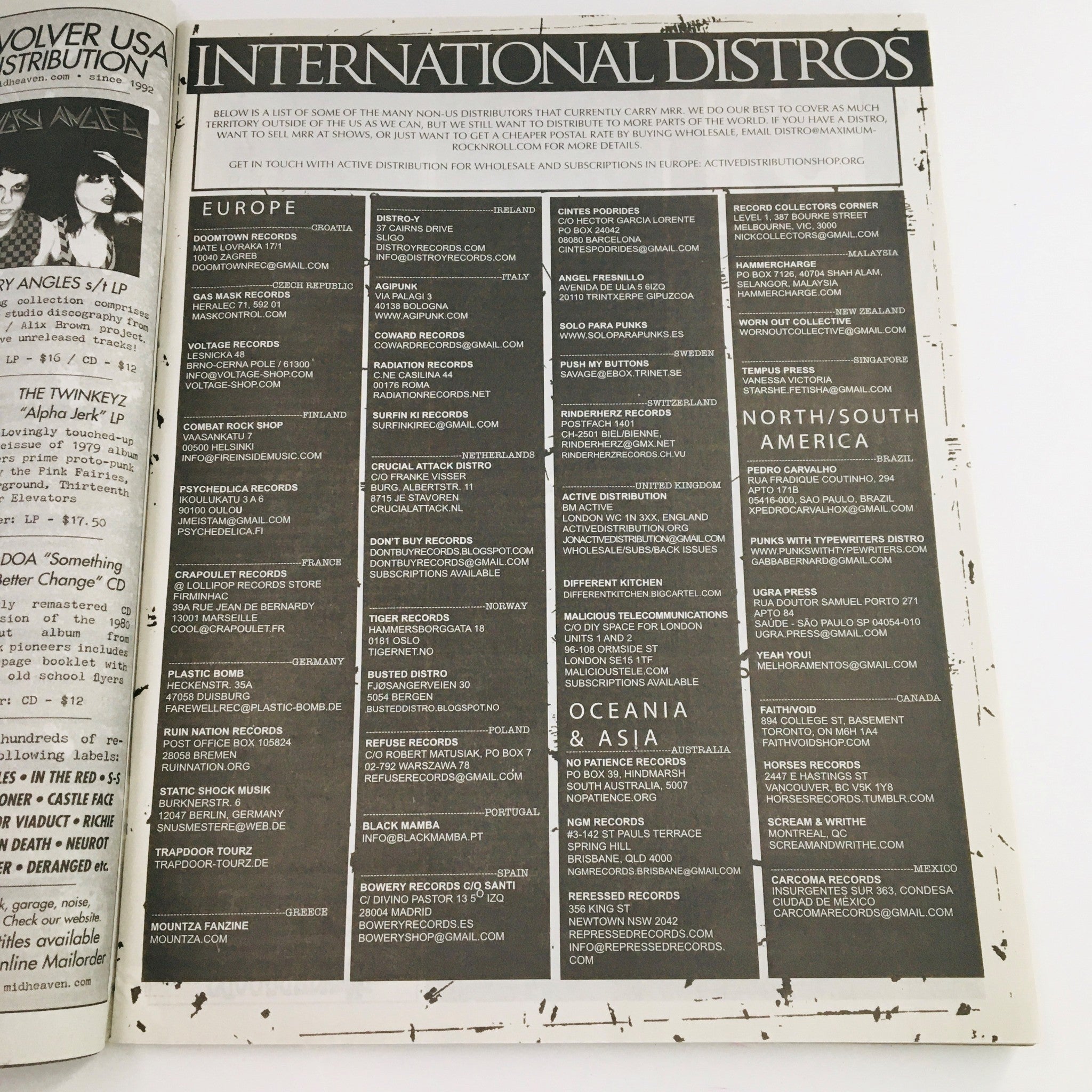 Page from Maximum RocknRoll Magazine July 2016 #398 listing international distributors, highlighting the global reach of punk music.