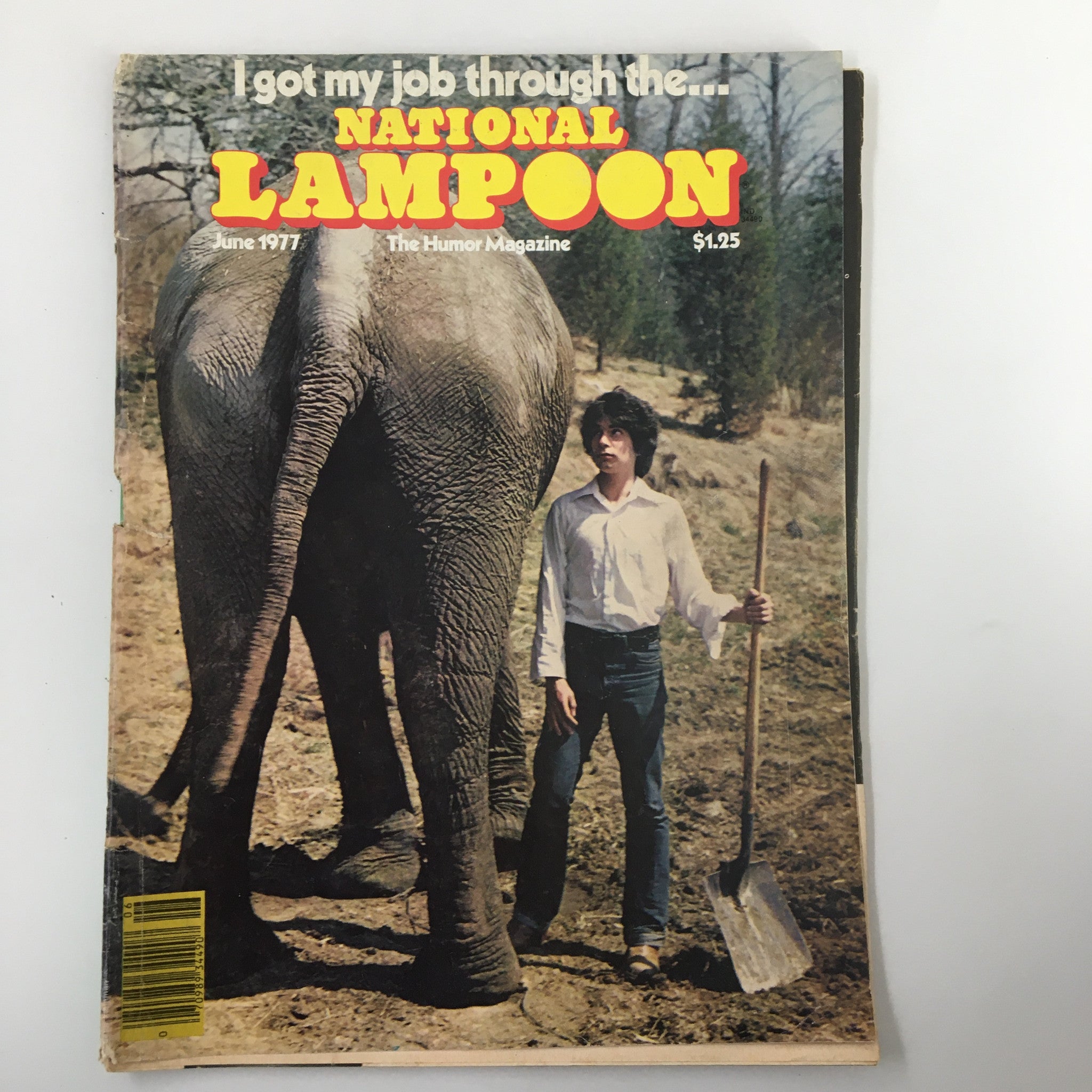 Cover of Vintage National Lampoon Humor Magazine June 1977 featuring the humorous title 'Operation Torn Rubber' with a man and an elephant in a natural setting.