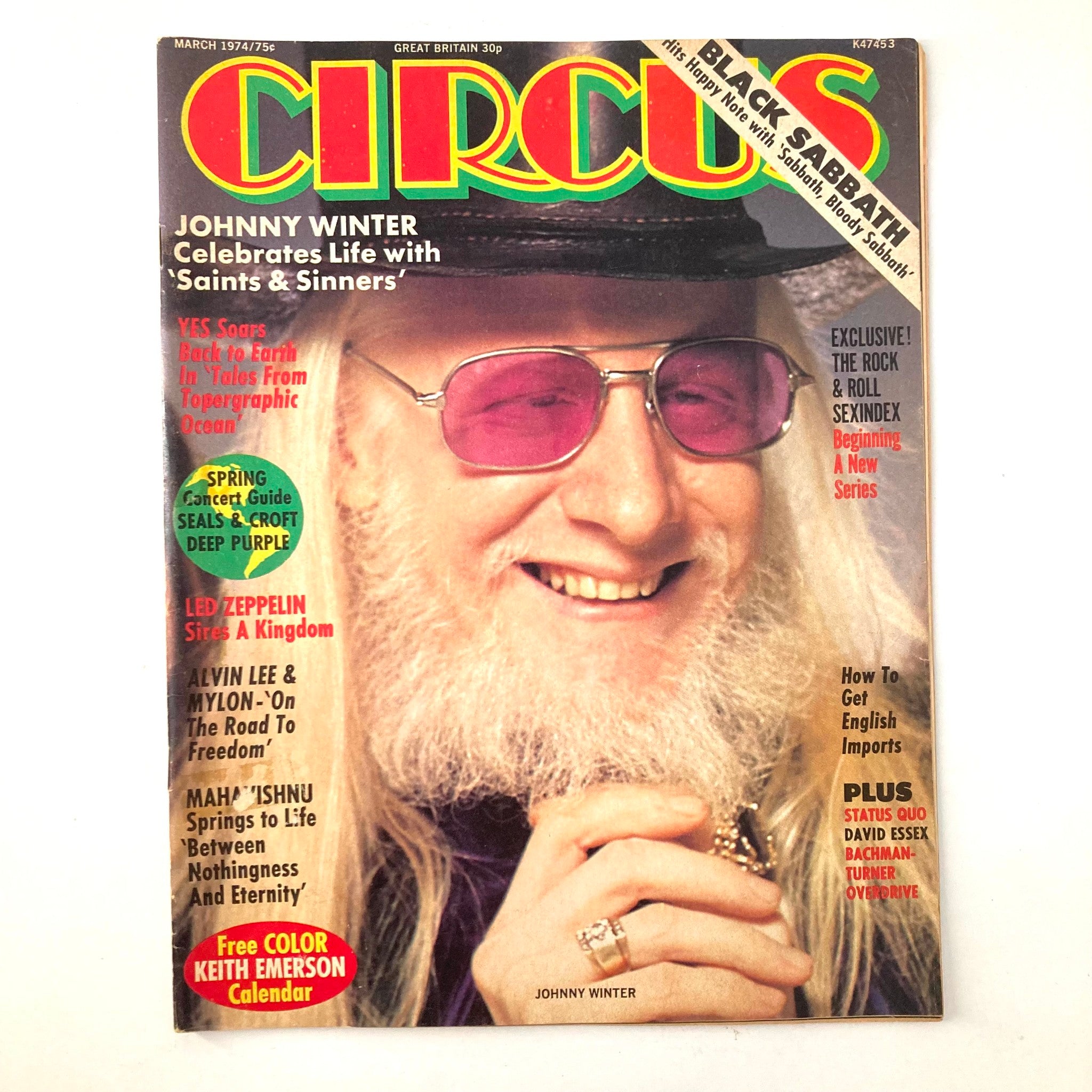 Cover of VTG Circus Magazine March 1974 titled 'Johnny Winter Celebrates Life with Saints & Sinners', featuring Johnny Winter wearing sunglasses and a hat, along with headlines about various rock artists.