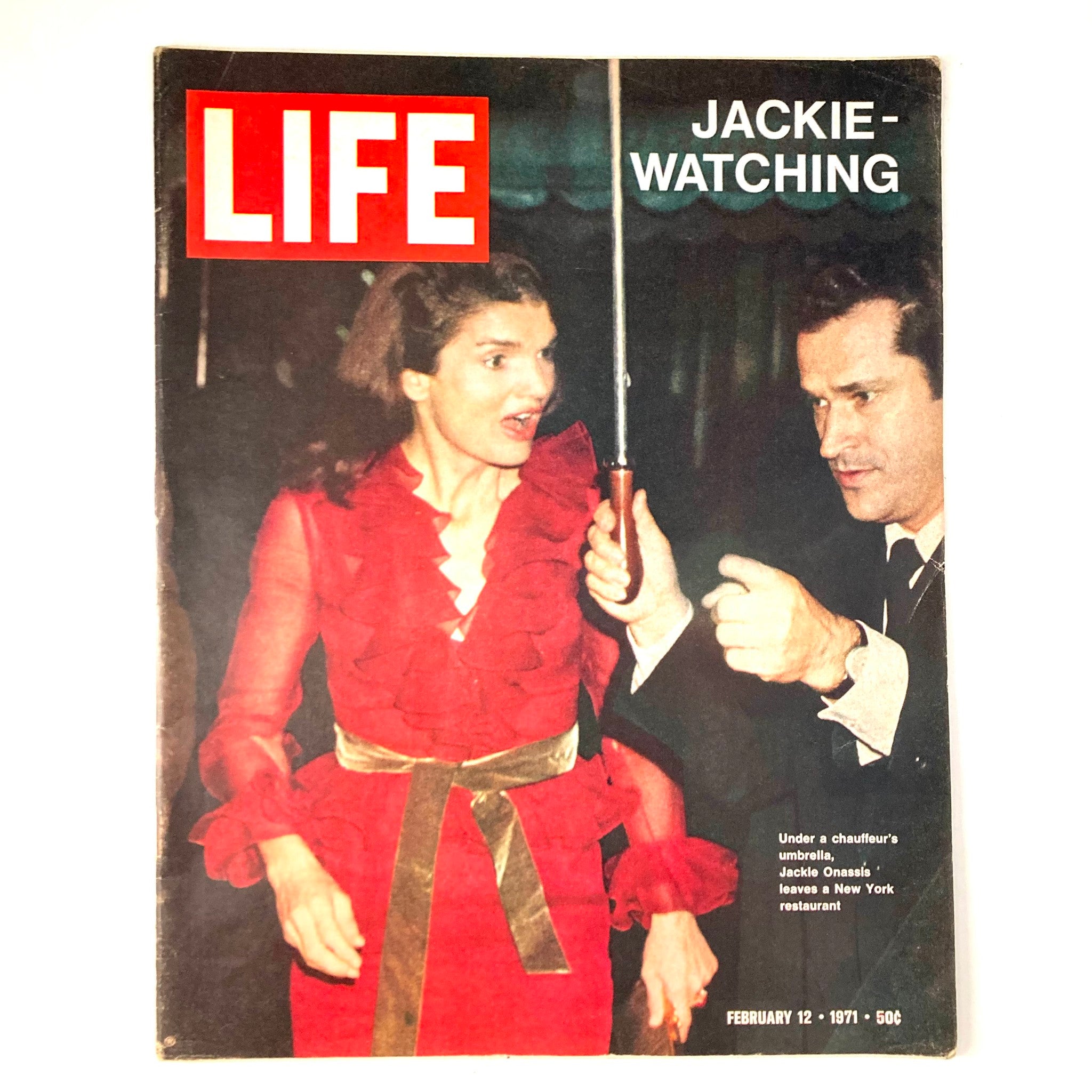 VTG Life Magazine February 12 1971 Vol 70 No. 5 Jackie Kennedy Onassis cover featuring Jackie O in a red dress and an umbrella, showcasing her iconic style during a notable public appearance.