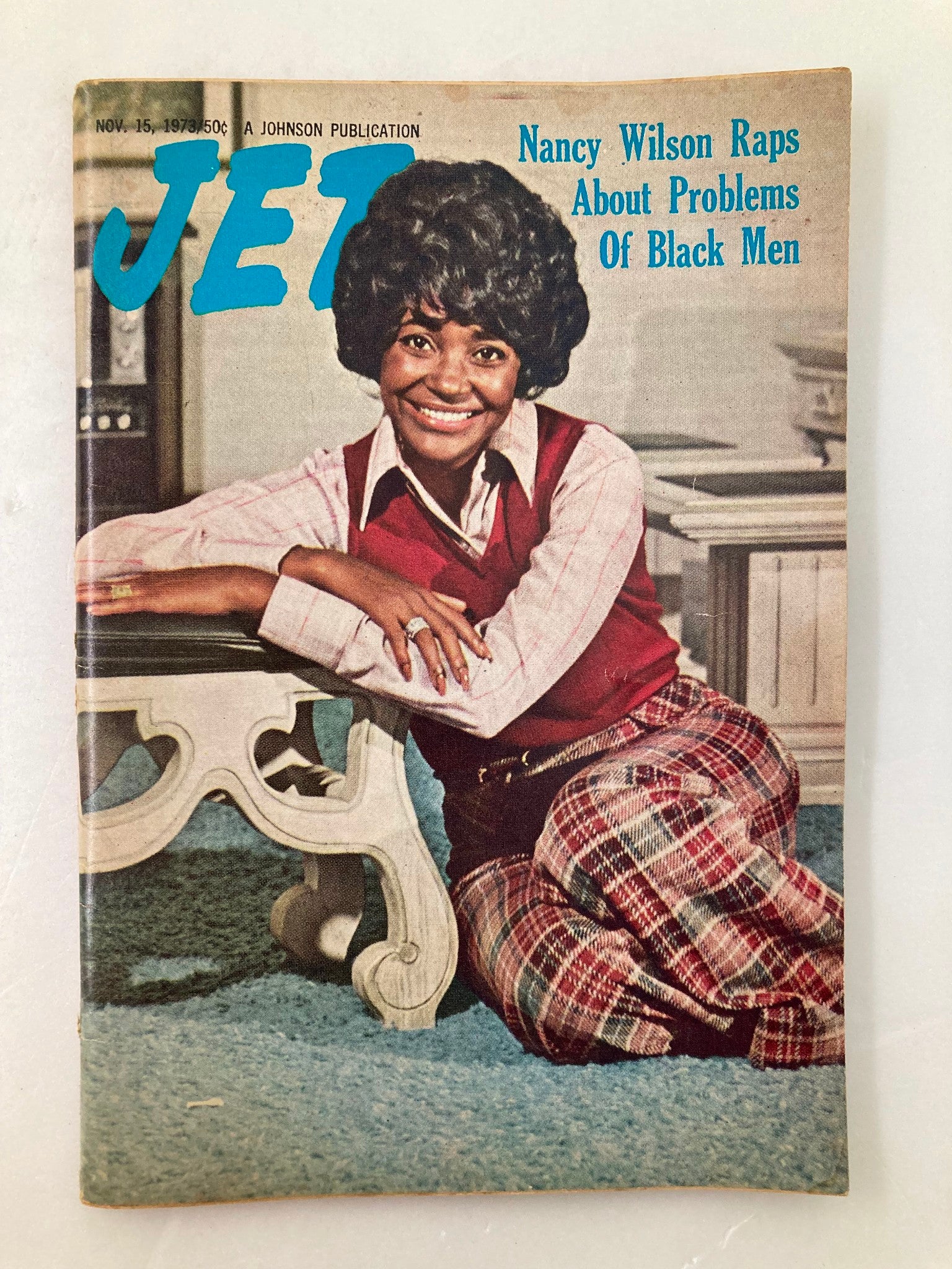 Cover of VTG Jet Magazine, November 15, 1973, Vol 45 #8 featuring Nancy Wilson. The magazine emphasizes an article titled 'Nancy Wilson Raps About Problems Of Black Men,' showcasing a smiling Nancy Wilson dressed in a stylish red and plaid outfit, seated on a floor with a decorative living room background.