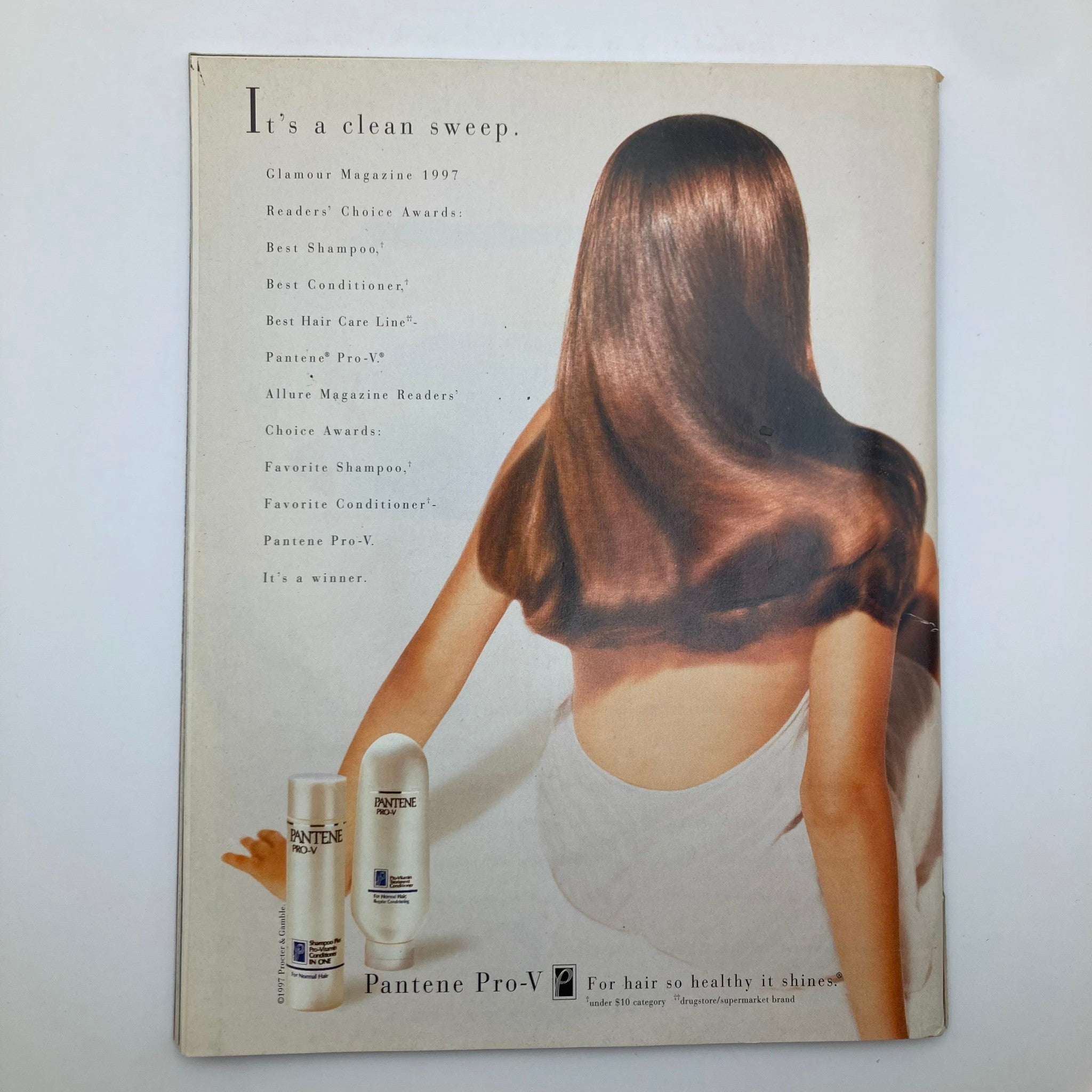 Back cover of Pantene Pro-V advertisement showcasing a woman with long, shiny hair, promoting the best shampoo and conditioner as recognized by Glamour Magazine 1997. People Weekly Magazine September 22 1997 Goodbye, Princess Diana.