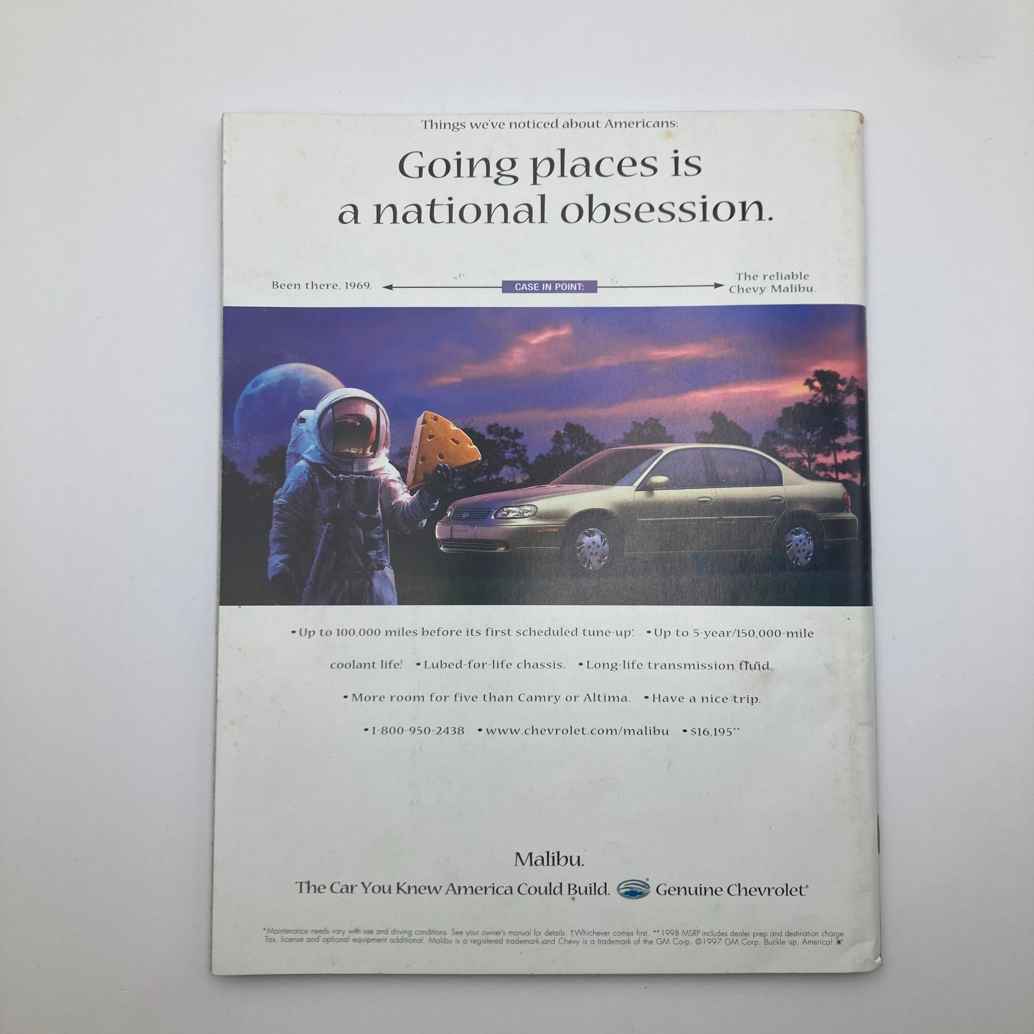 Back cover of the People Weekly Magazine Fall 1997 Tribute to Diana, Princess of Wales, featuring an advertisement for the Chevy Malibu with an astronaut holding cheese in a surreal setting.