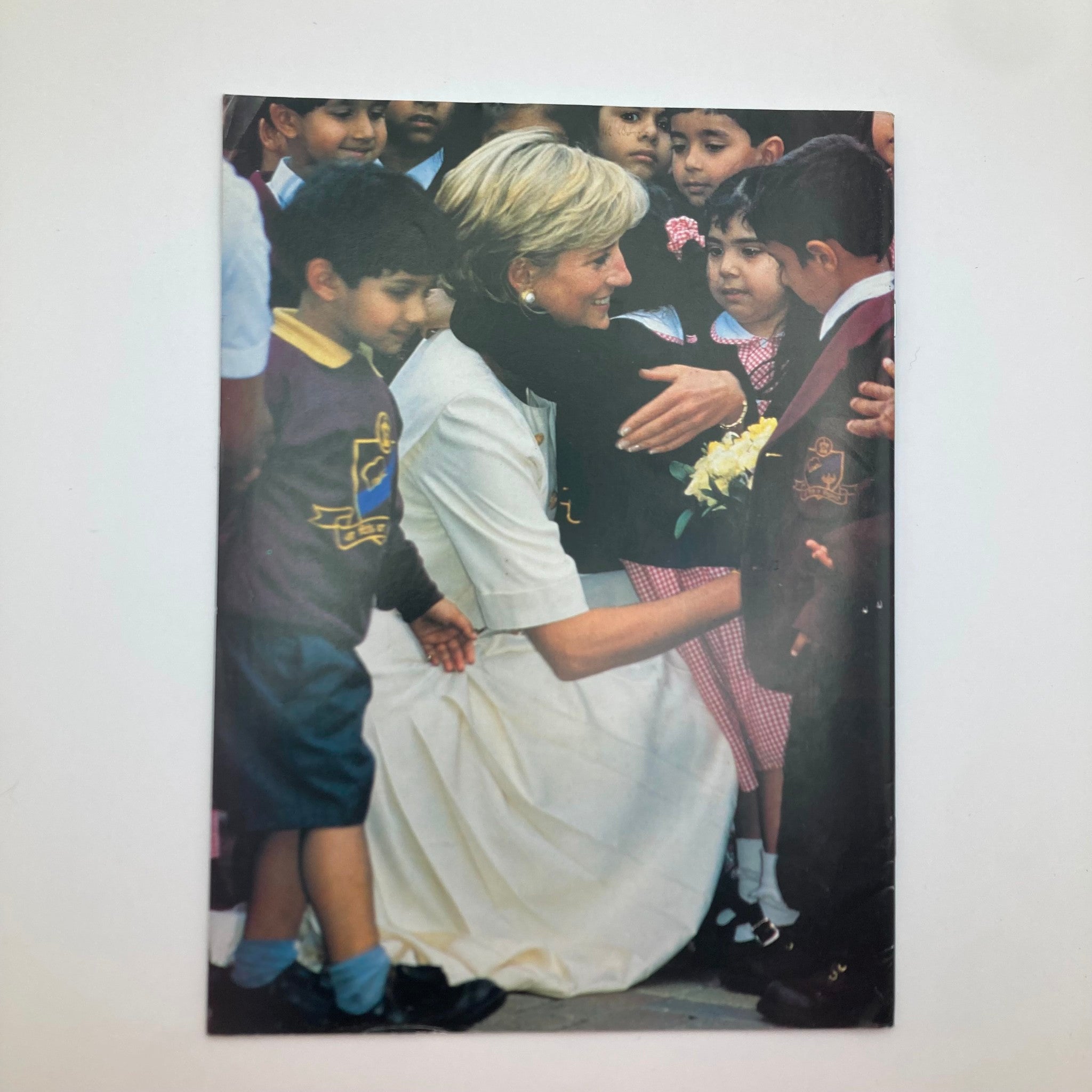 Image of Princess Diana engaging with children, showcasing her compassionate nature and dedication to humanitarian efforts. People Weekly Magazine September 22 1997 Goodbye, Princess Diana.