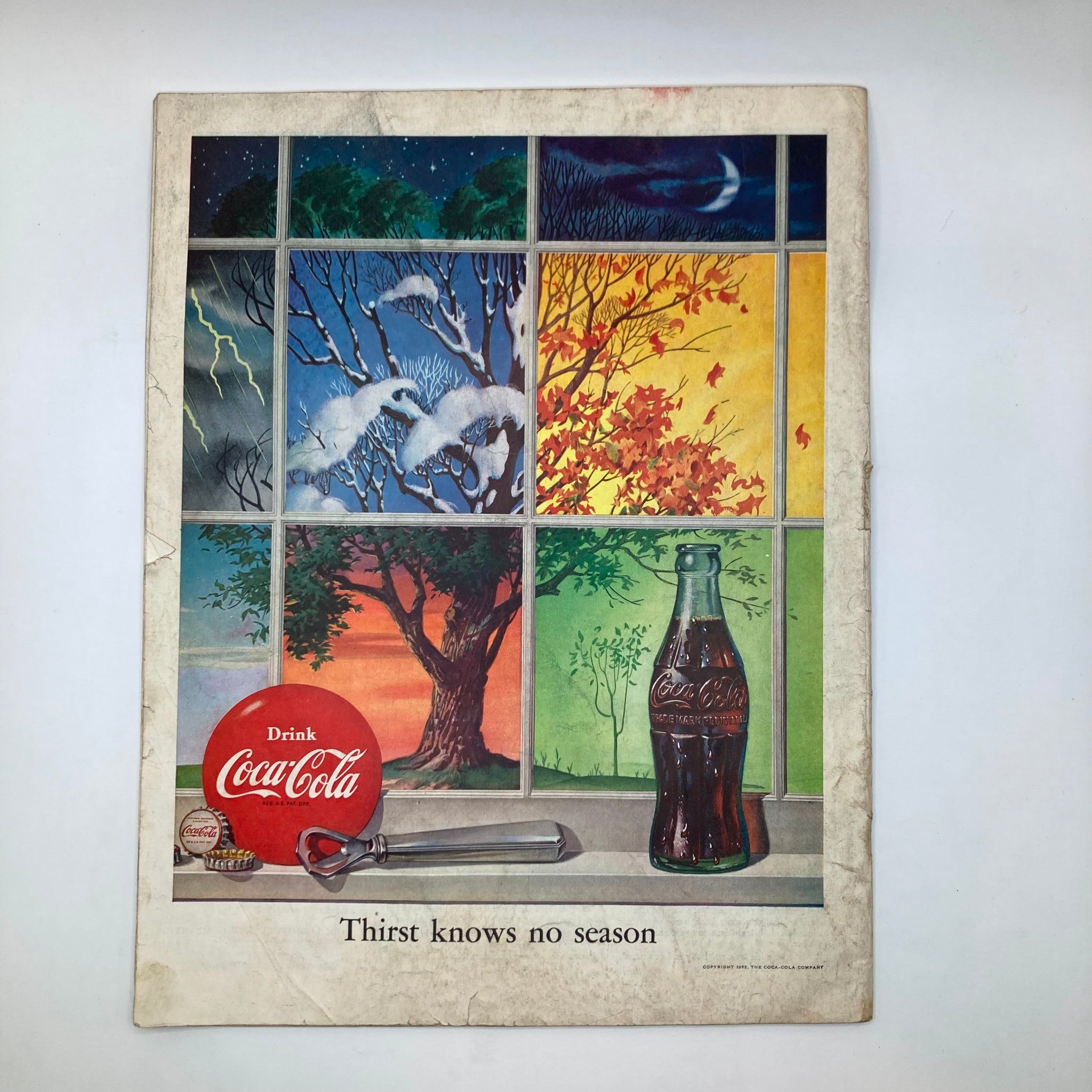 Back cover of the Saturday Evening Post Magazine December 27, 1952, showcasing a colorful Coca-Cola advertisement emphasizing the seasonal message 'Thirst Knows No Season'.