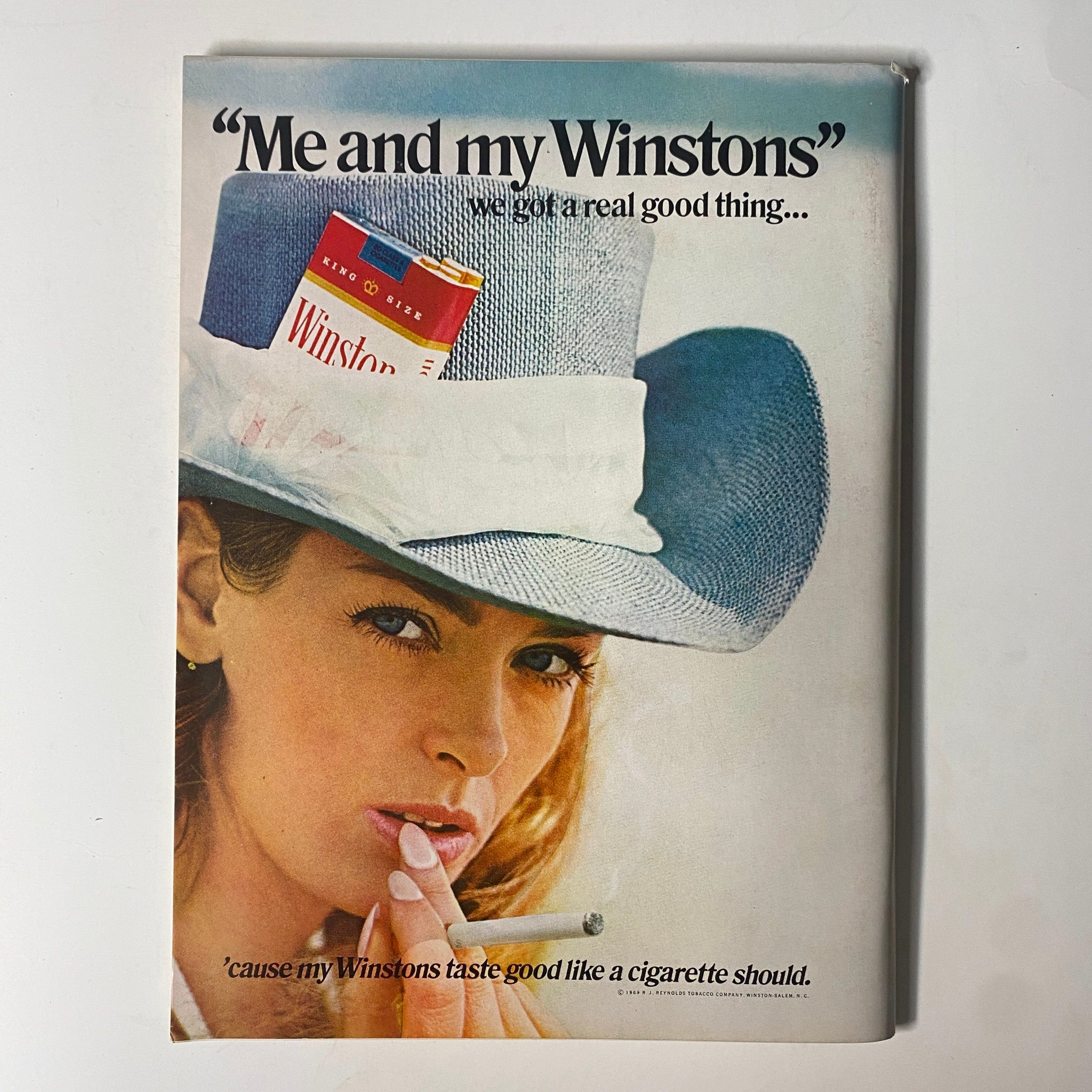 Ad page from Playboy Magazine August 1969 featuring a trendy model promoting Winston cigarettes, highlighting the advertising style of the era.