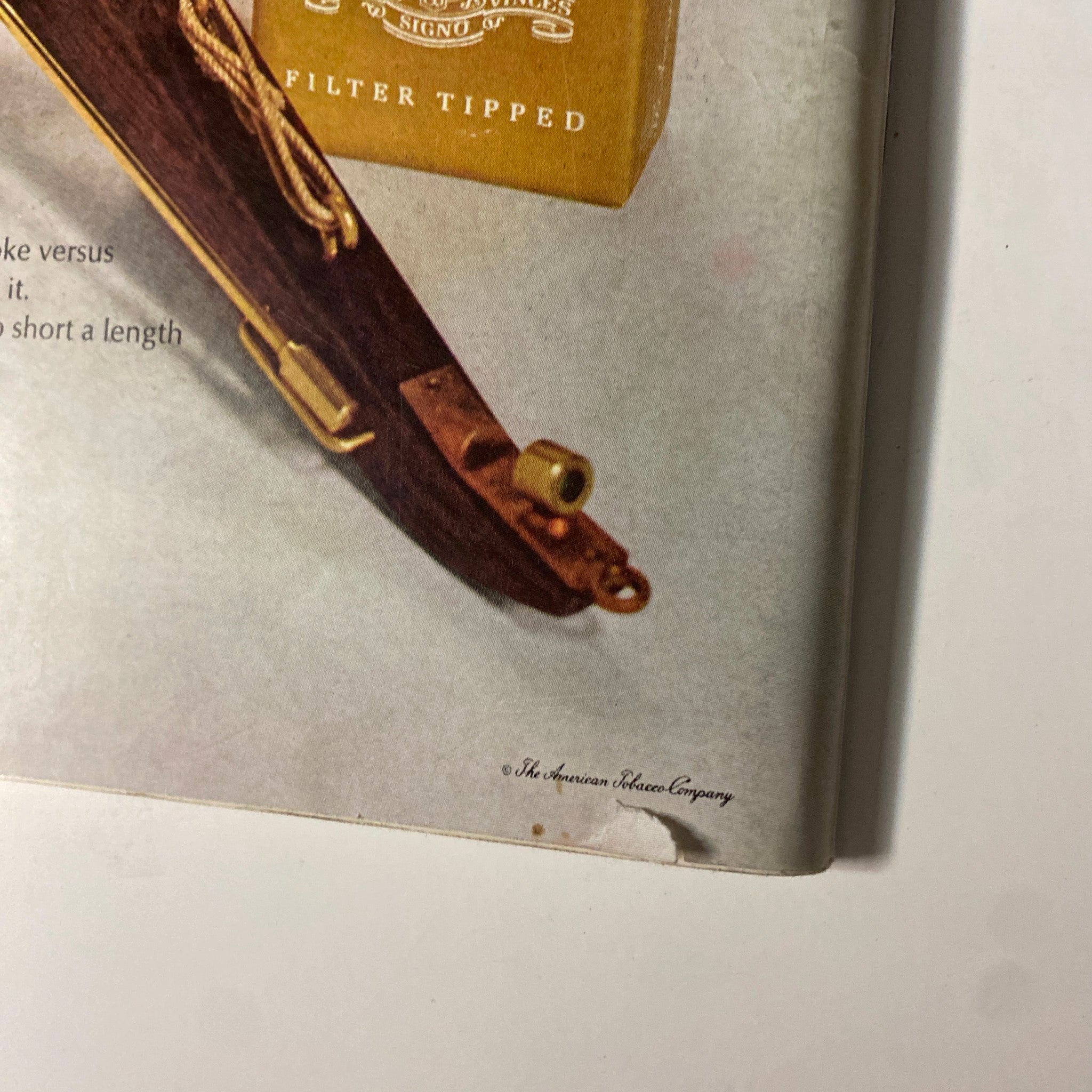 Close-up view of the Pall Mall cigarette advertisement in Playboy Magazine November 1967, detailing the product's positioning against the backdrop of a cannon, reflecting the bold marketing strategies of the 1960s.