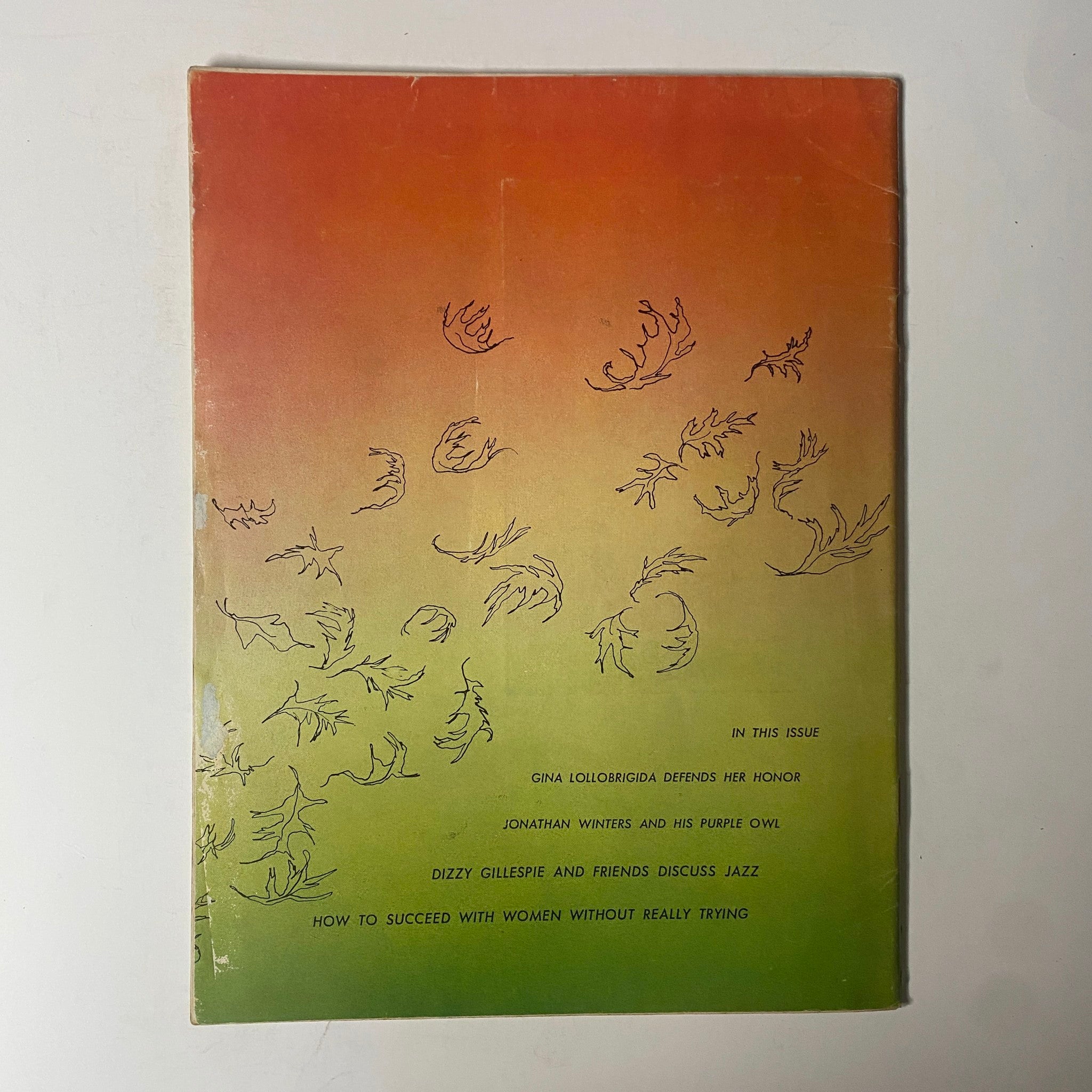 Back cover of Playboy Magazine November 1955 showcasing an abstract design with playful, whimsical illustrations, reflecting the artistic style of the era.