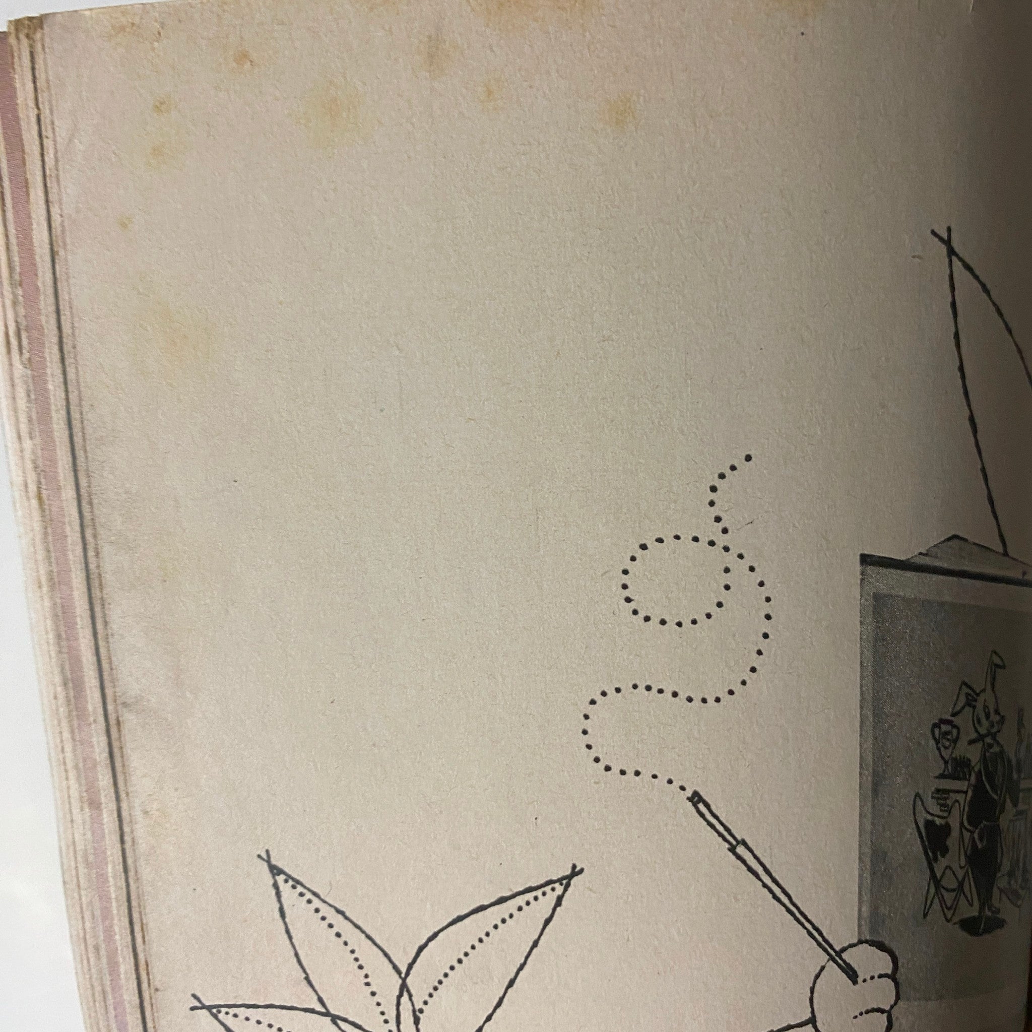 Interior page of Playboy Magazine August 1955 with vintage illustrations and light water stains, preserving its historical charm.