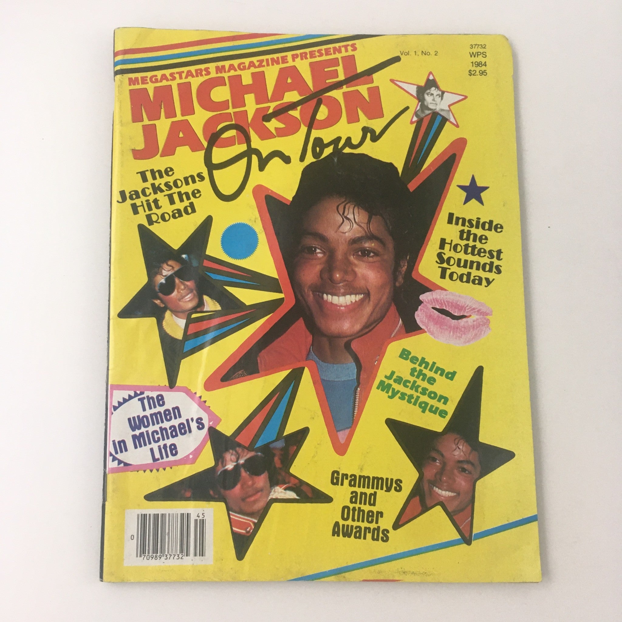 Cover of Megastars Magazine Vol 1 #2 from 1984 featuring Michael Jackson and The Jacksons on Tour, showcasing vibrant colors, star motifs, and images of Michael Jackson, emphasizing his iconic presence in pop culture.