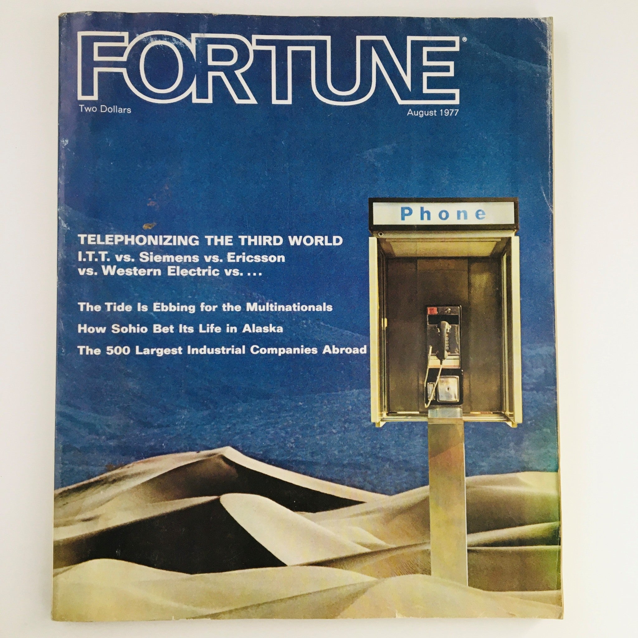Cover of Fortune Magazine, August 1977 edition titled 'Telephonizing The Third World', featuring a phone booth and articles on telecommunications advancements and global companies.