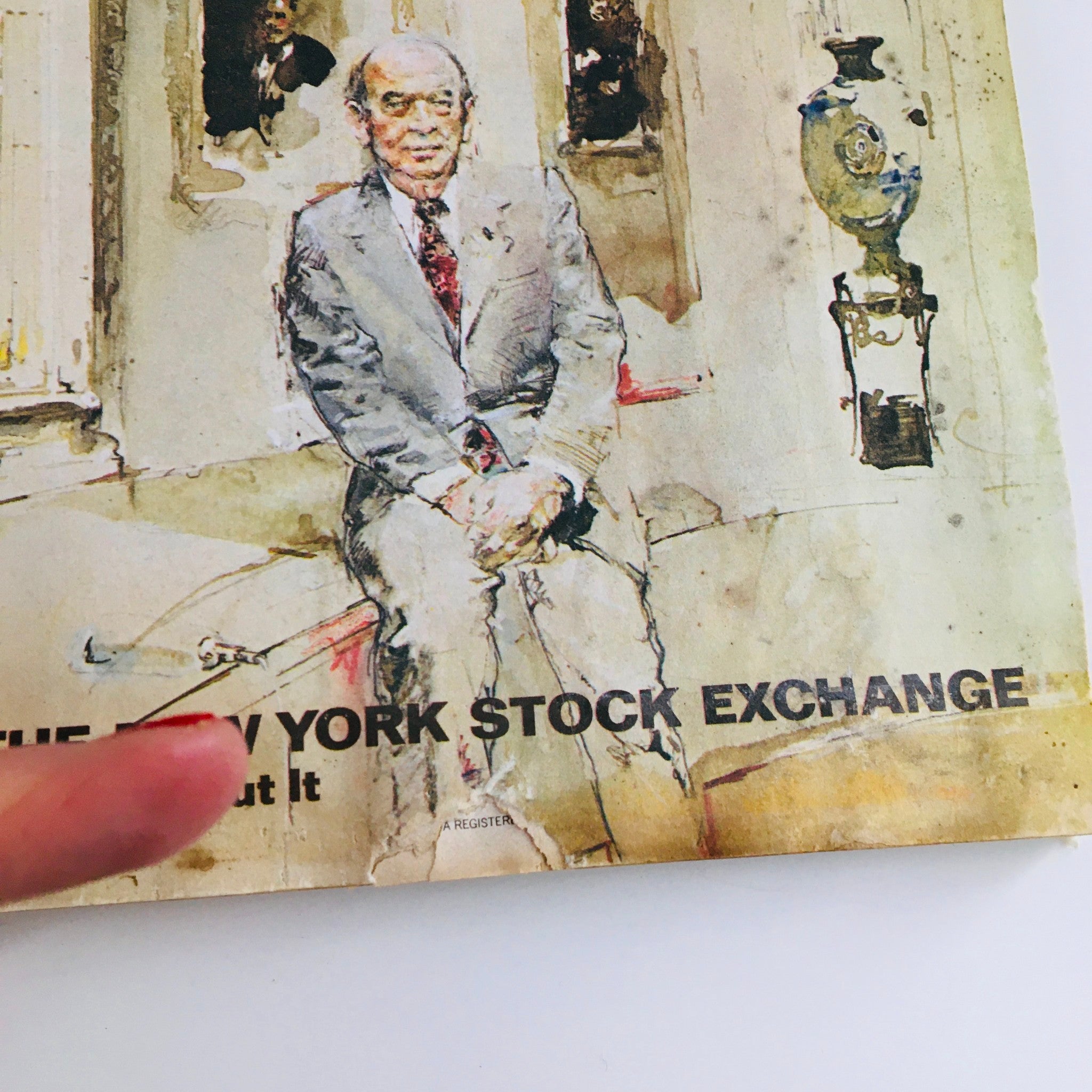 Detailed view of the Fortune Magazine March 1977 cover focusing on the title 'The Threat To The New York Stock Exchange', featuring an illustration of a seated man with an ornate background and historical context.