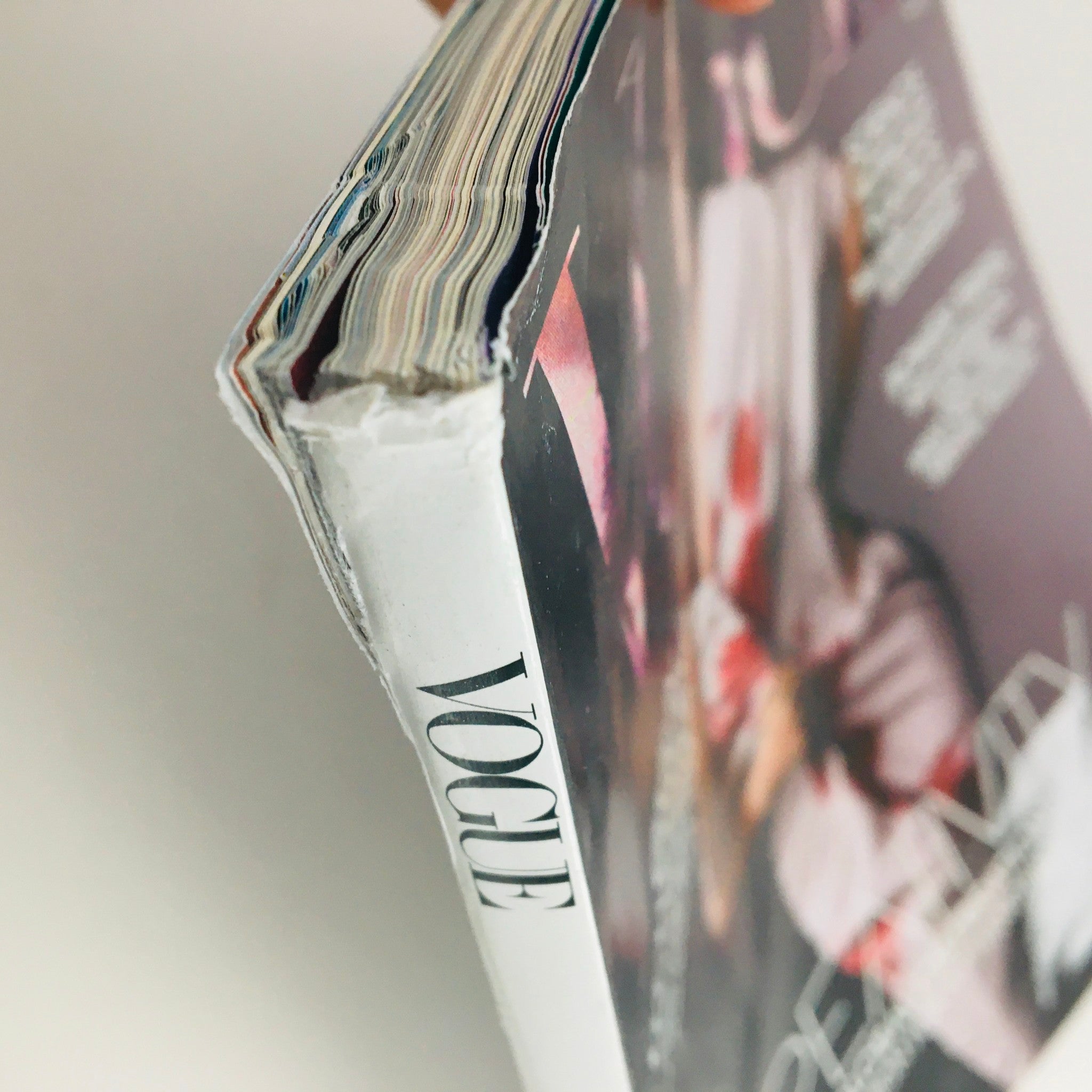 Side view of the Vogue Magazine March 2021 showcasing worn edges, emphasizing its collectible nature.
