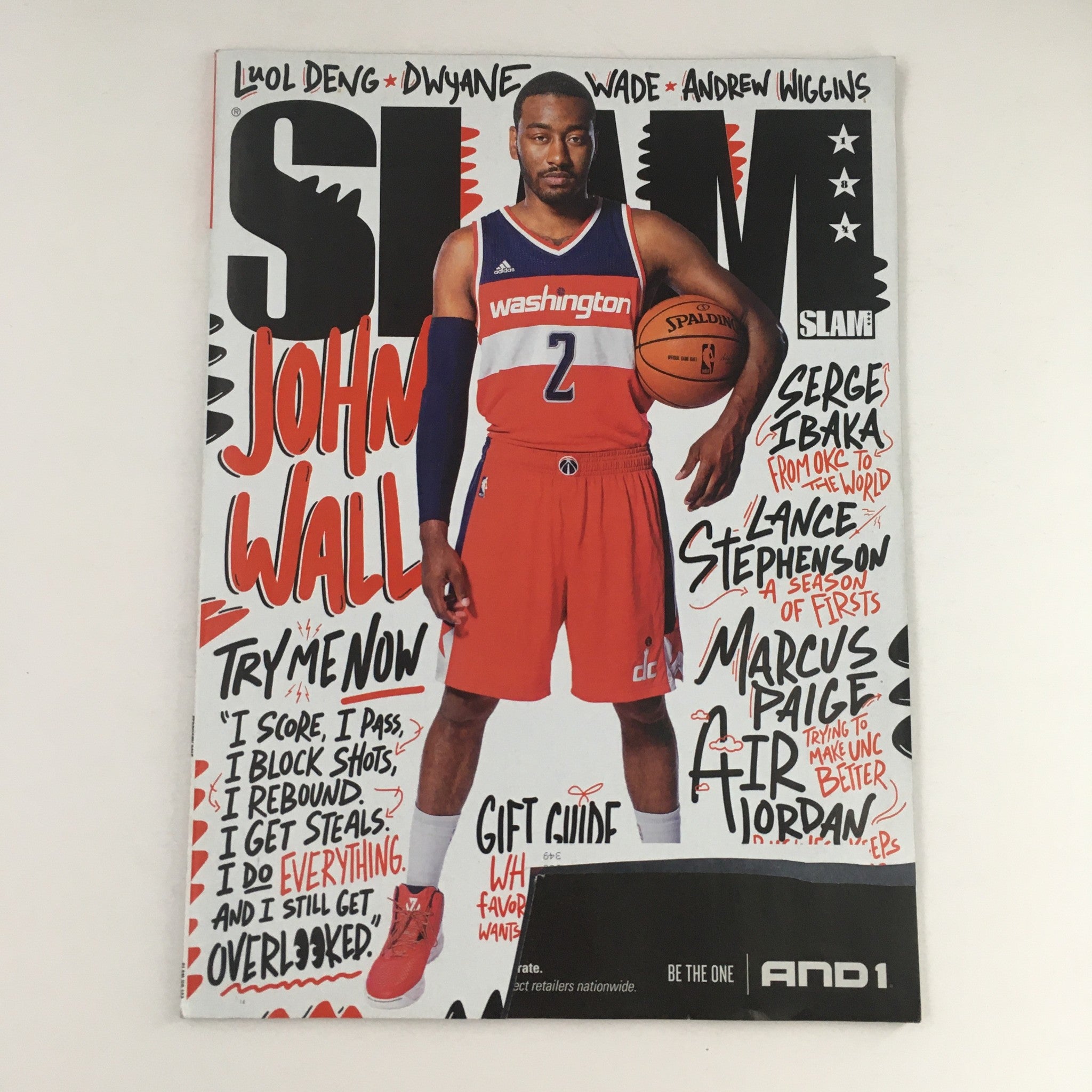 Cover of Slam Magazine February 2015 Issue #184 featuring NBA player John Wall in Washington Wizards uniform with vibrant illustrations and text.