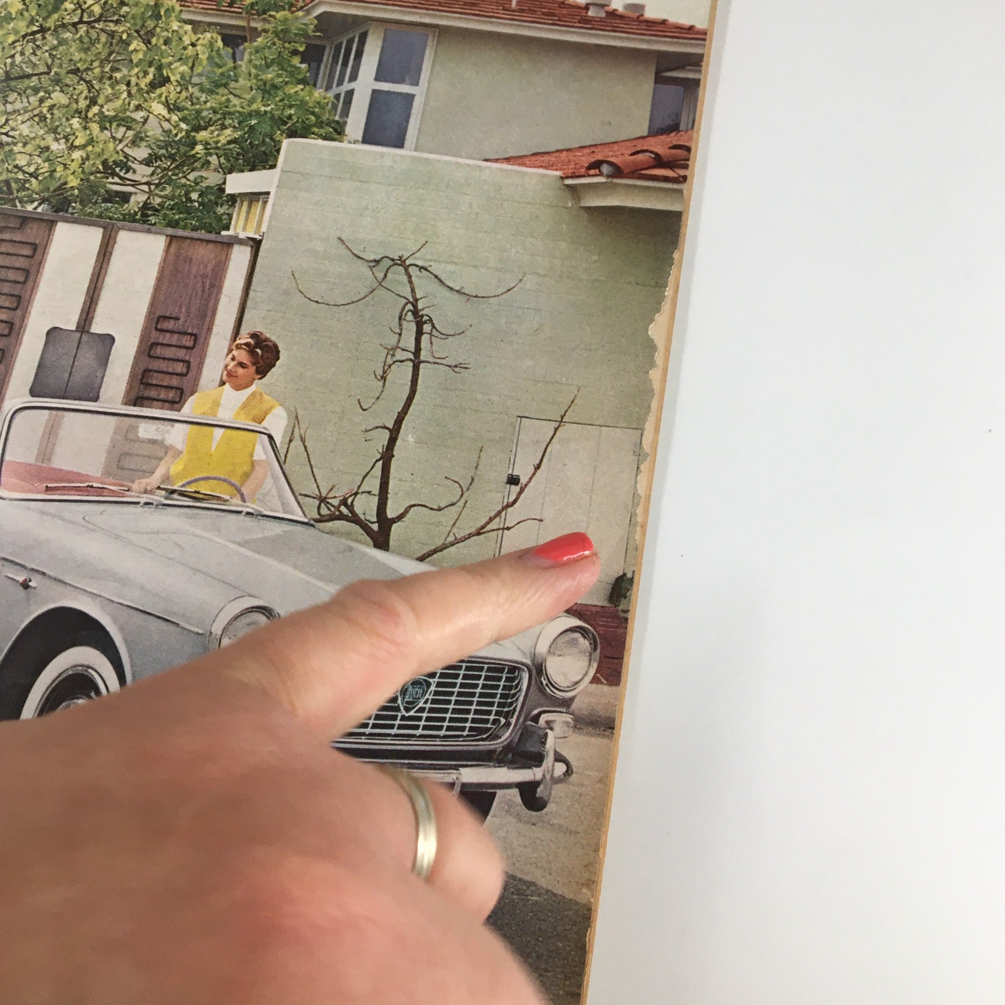 Close-up of the VTG Road & Track Magazine June 1959 cover, focusing on the vintage car and a woman pointing, showcasing the magazine's nostalgic automotive theme.