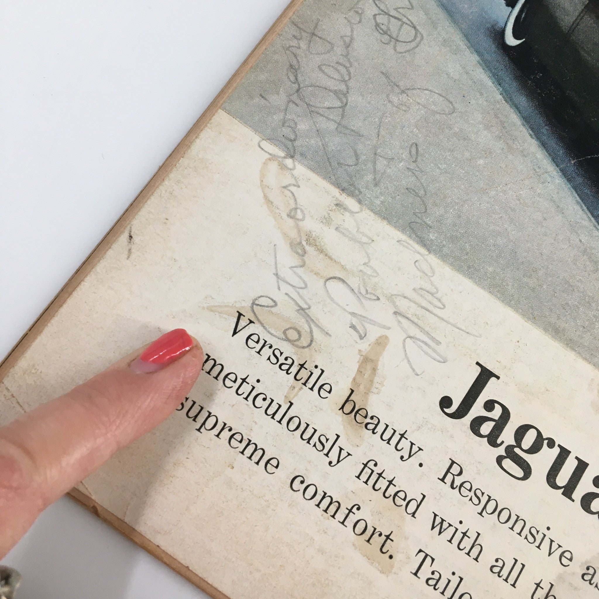 Close-up view of a vintage advertisement in VTG Road & Track Magazine January 1959, discussing luxury car features.