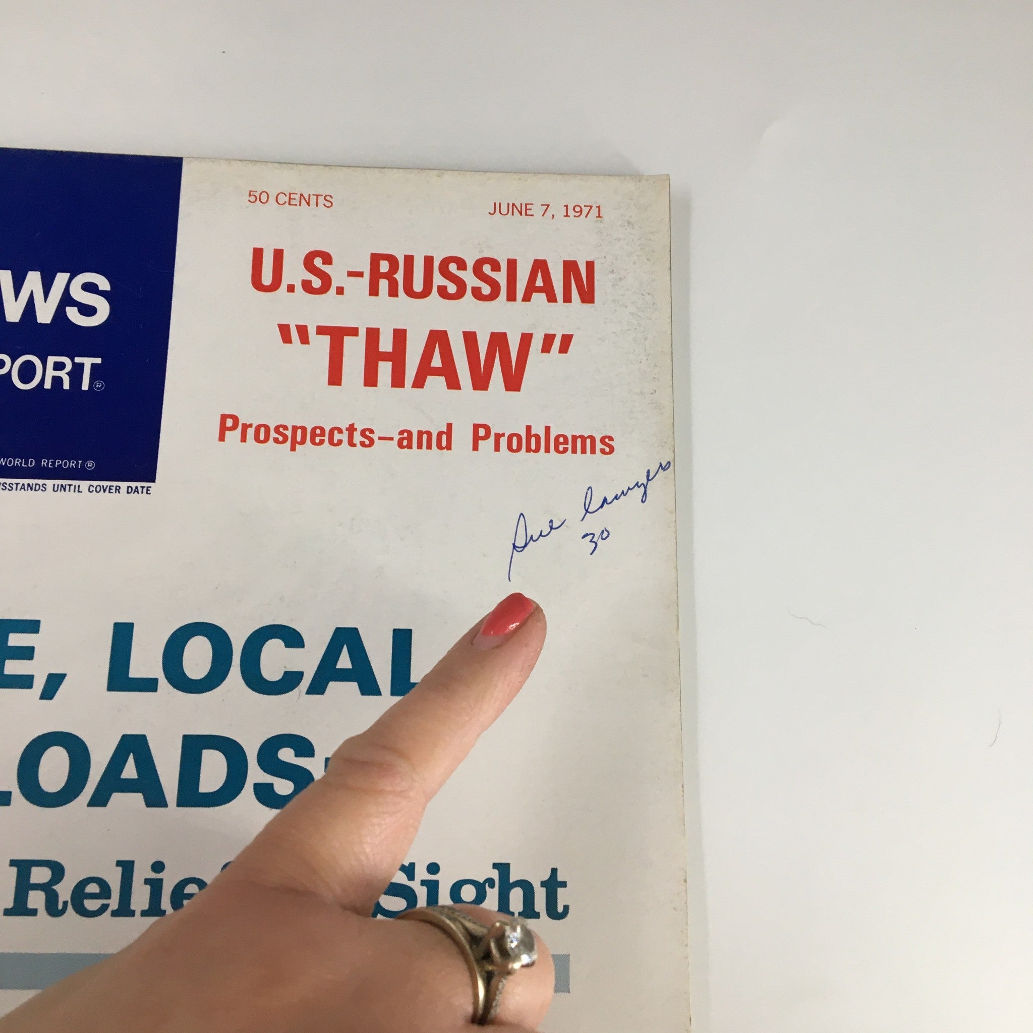 Close-up of the US News & World Report Magazine June 7, 1971 cover showing the headline and a handwritten signature, highlighting its vintage appeal.