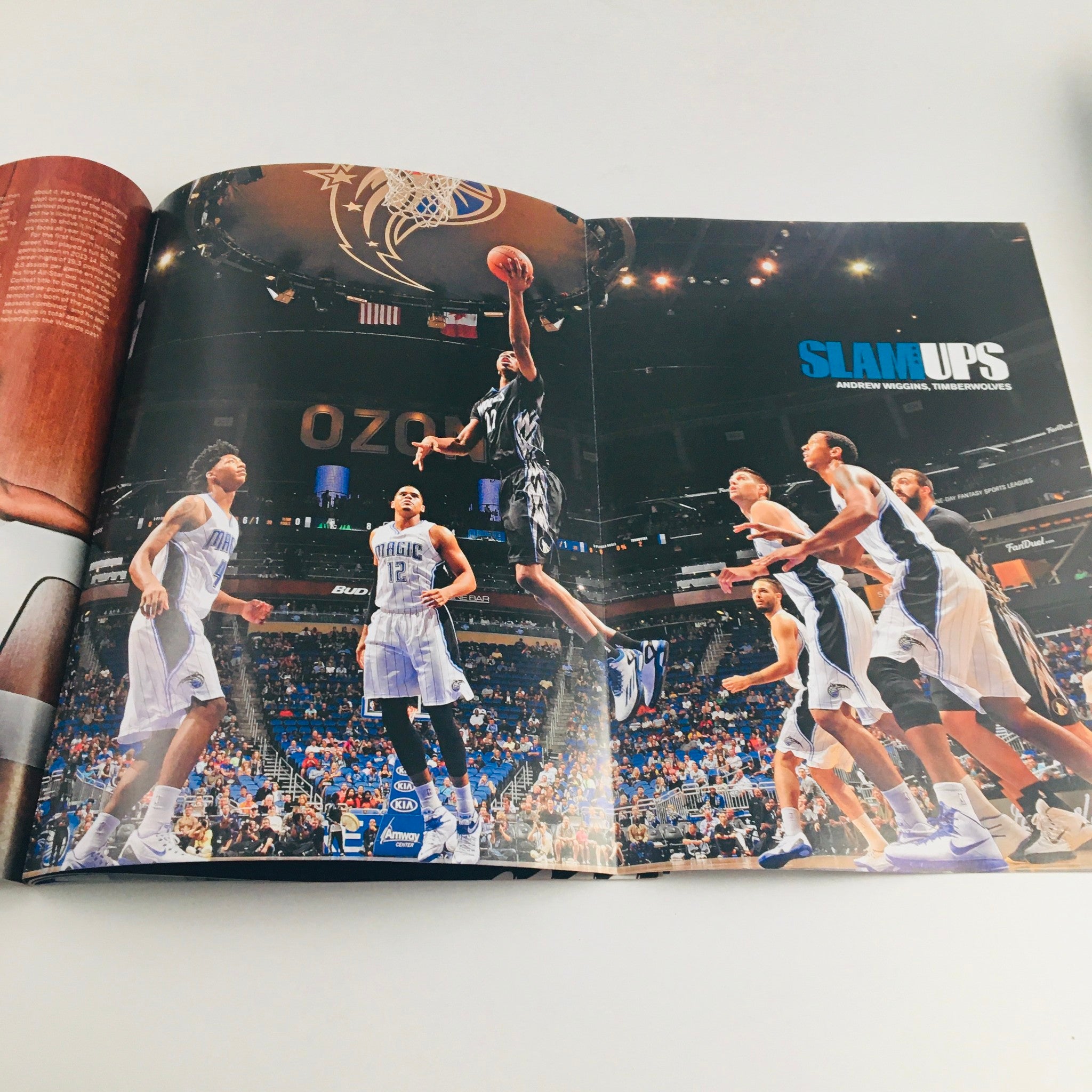 Inside spread of Slam Magazine February 2015 displaying a dramatic action shot of a player jumping during a game, branded with SLAM UPS.