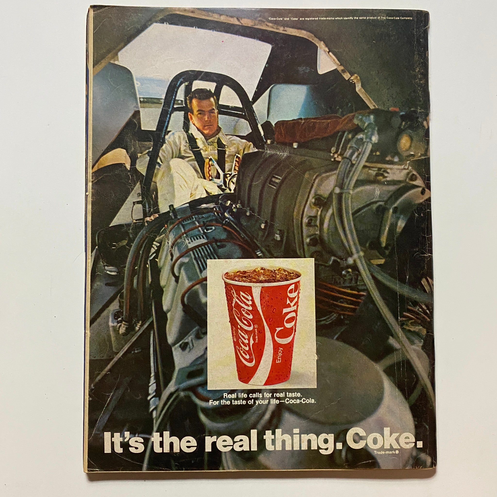 Back cover of VTG Hot Rod Magazine June 1970 featuring a Coca-Cola advertisement with a racing theme, depicting a driver in a high-performance vehicle.