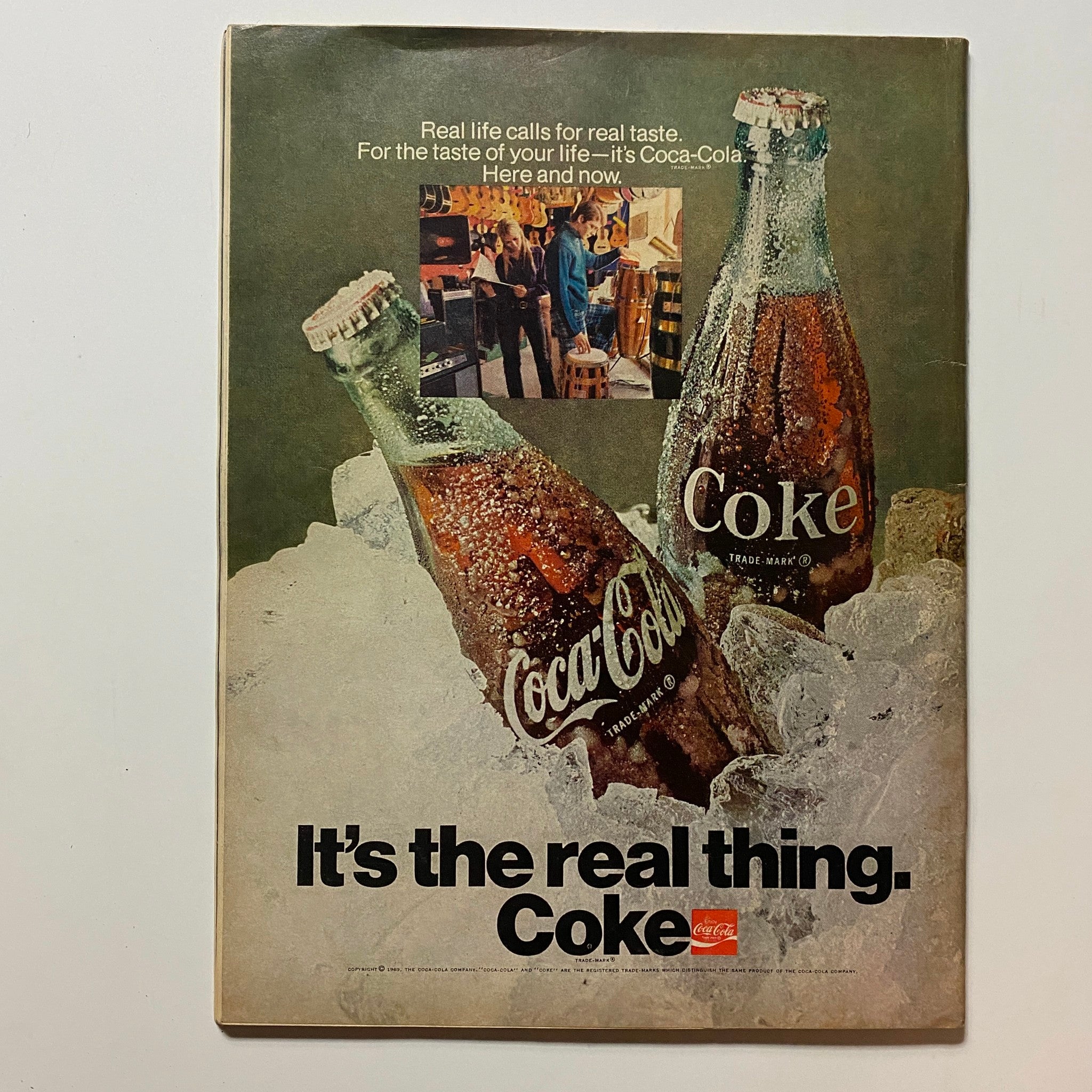 Back cover of VTG Hot Rod Magazine January 1970 displaying a Coca-Cola advertisement with two vintage glass bottles on ice, emphasizing classic Americana.
