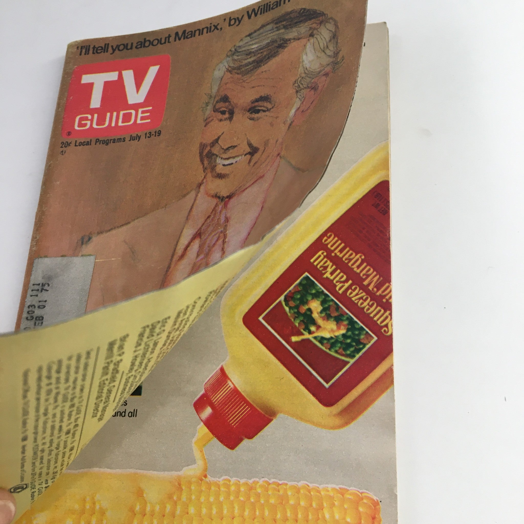 Page of TV Guide Magazine July 13 1974 with Johnny Carson cover, revealing advertisement for Squeeze Parkay margarine, highlighting retro marketing.