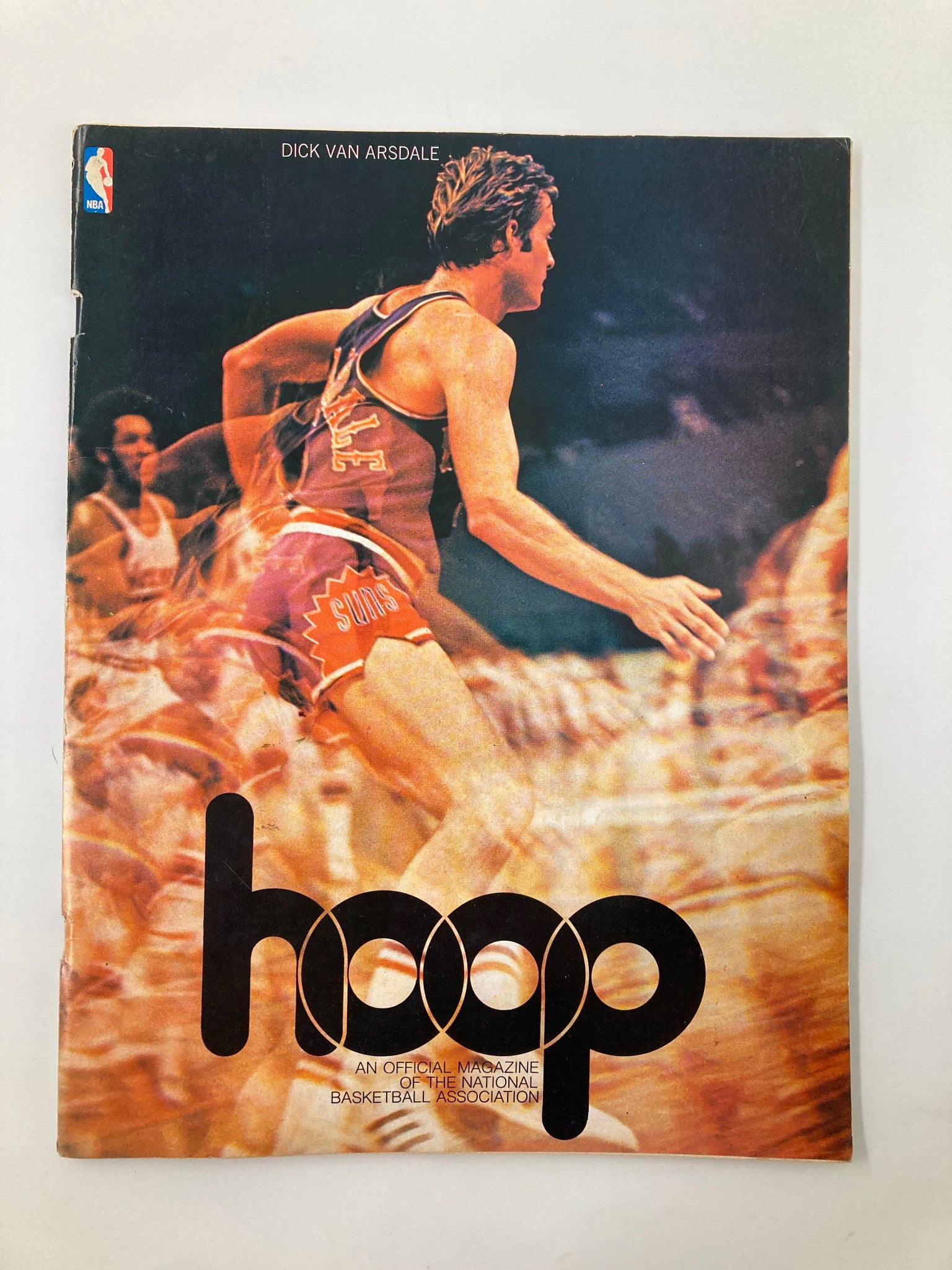 Cover of VTG Hoop NBA Magazine 1974-1975 Directory featuring Dick Van Arsdale. The colorful design highlights Van Arsdale in action and showcases the magazine's vintage appeal, perfect for basketball fans and collectors.