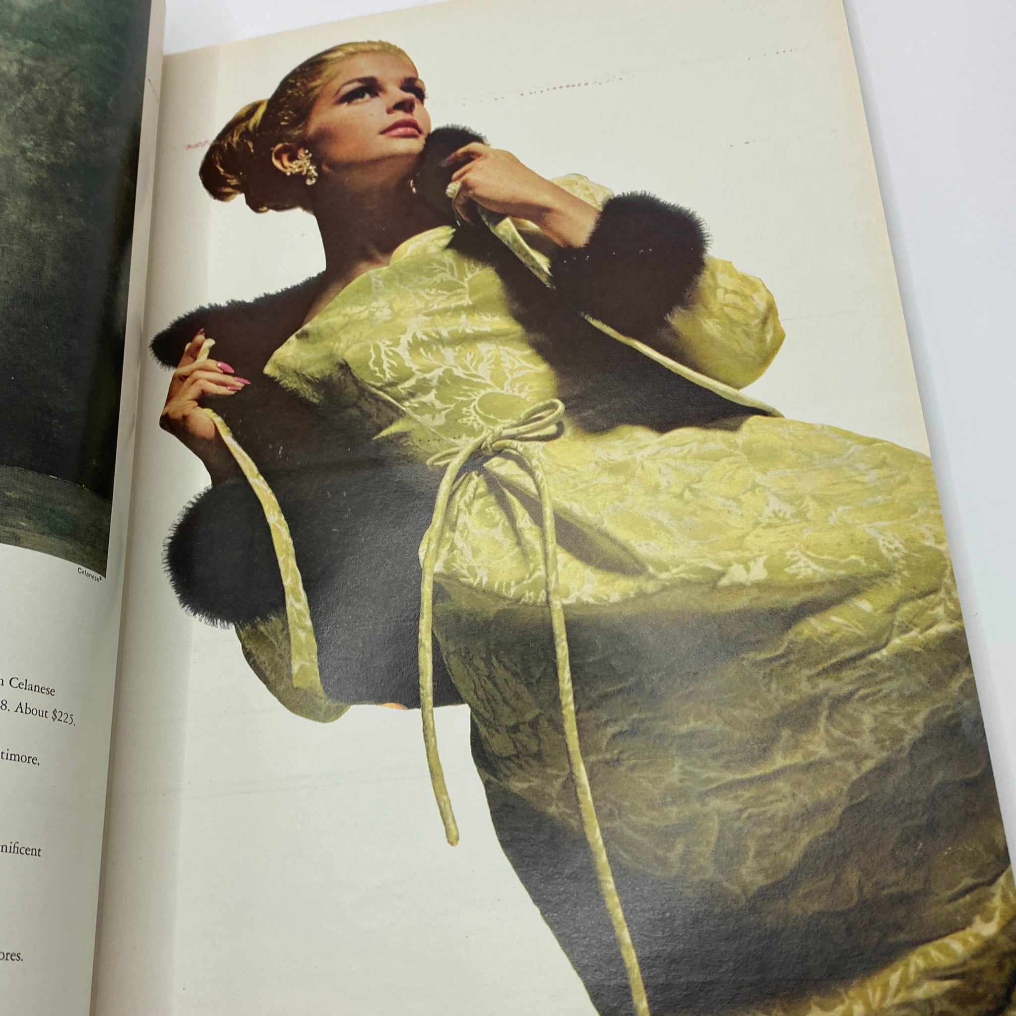 Vintage fashion photography from VTG Vogue Magazine October 1 1964 depicting a model in an elegant gown with luxurious details.