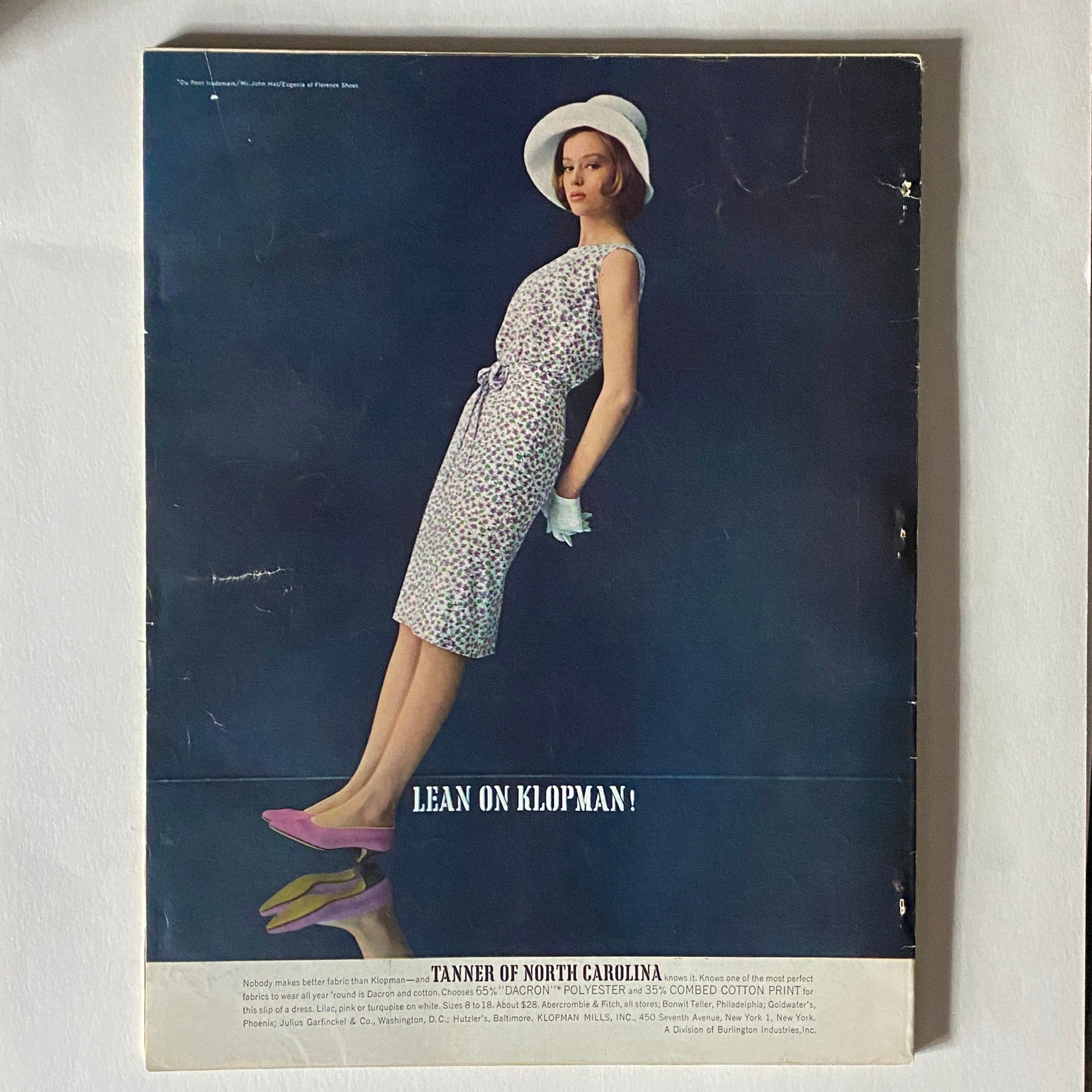 VTG Vogue Magazine April 1 1963 featuring a model in a floral dress and hat promoting Klopman textiles, showcasing 1960s fashion.