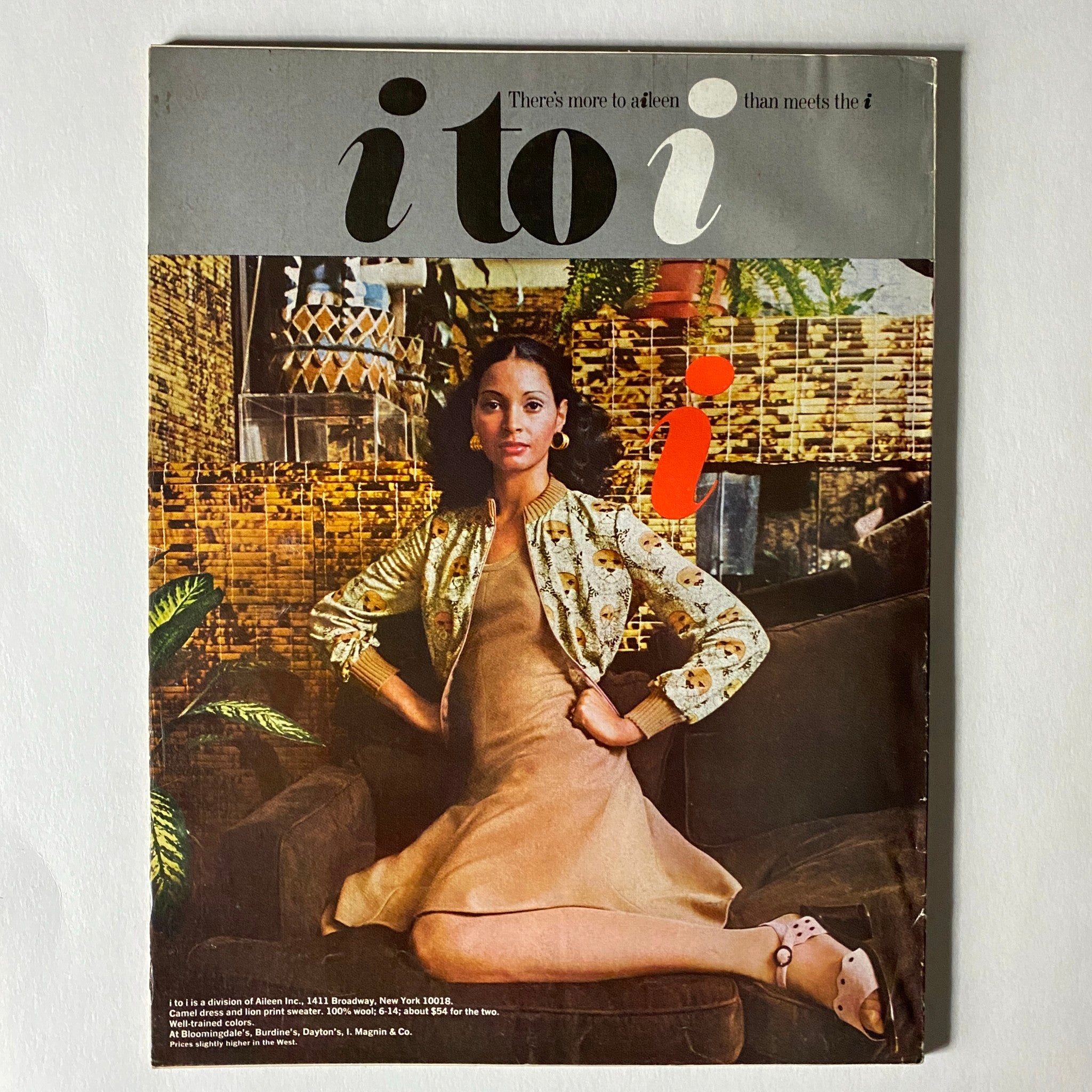Cover page of the i to i magazine featured in VTG Vogue Magazine August 1 1972, highlighting a model in an elegant outfit with a unique design against a patterned backdrop.
