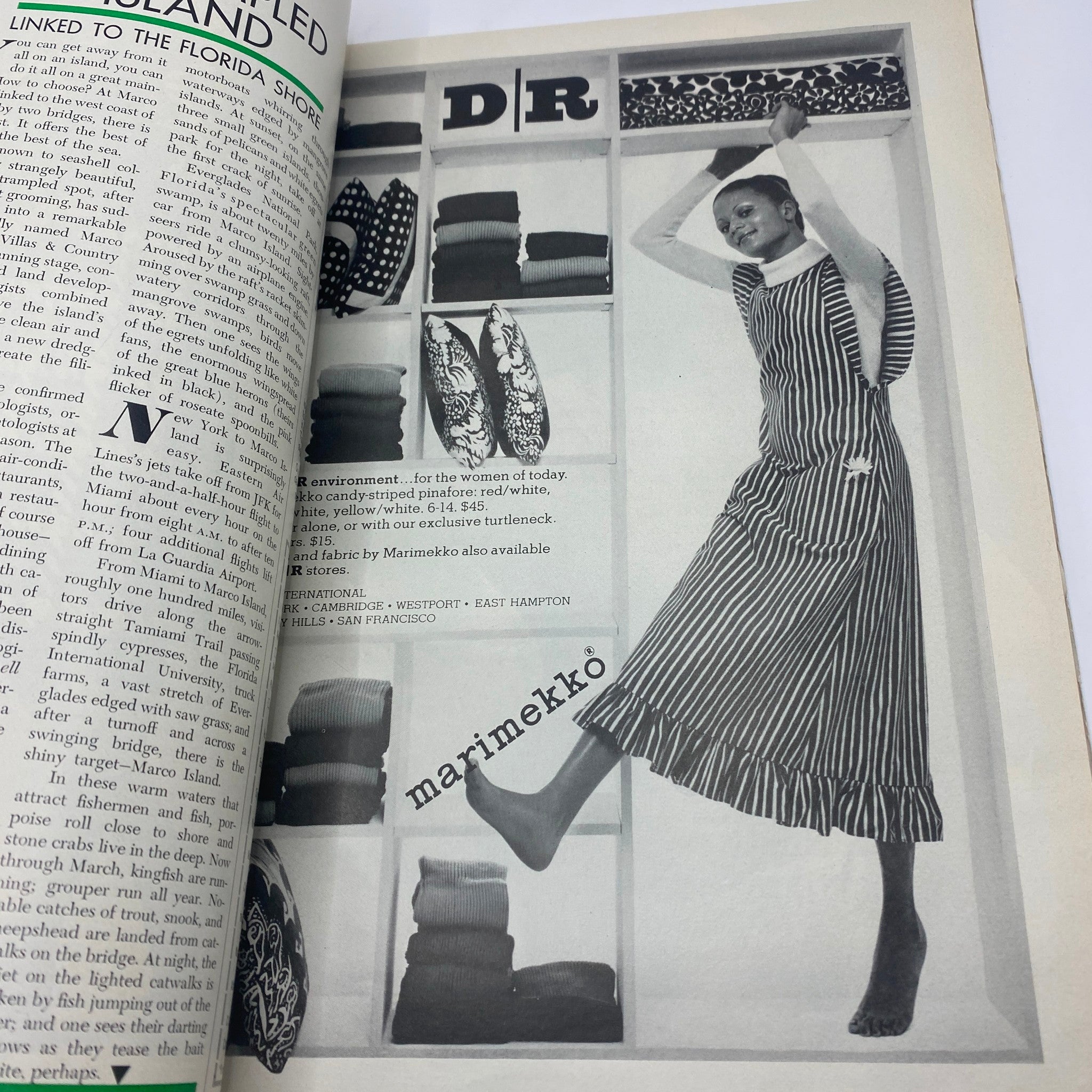Another interior page of VTG Vogue Magazine February 1 1972 highlighting a model in Marimekko attire with a striped dress, emphasizing early 70s fashion trends.
