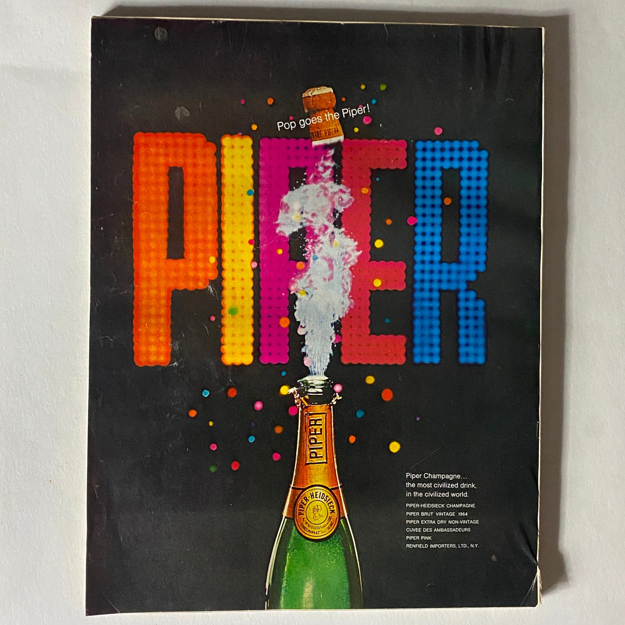 VTG Vogue Magazine June 1970 advertisement for Piper Champagne with colorful and playful design featuring a bottle of champagne.