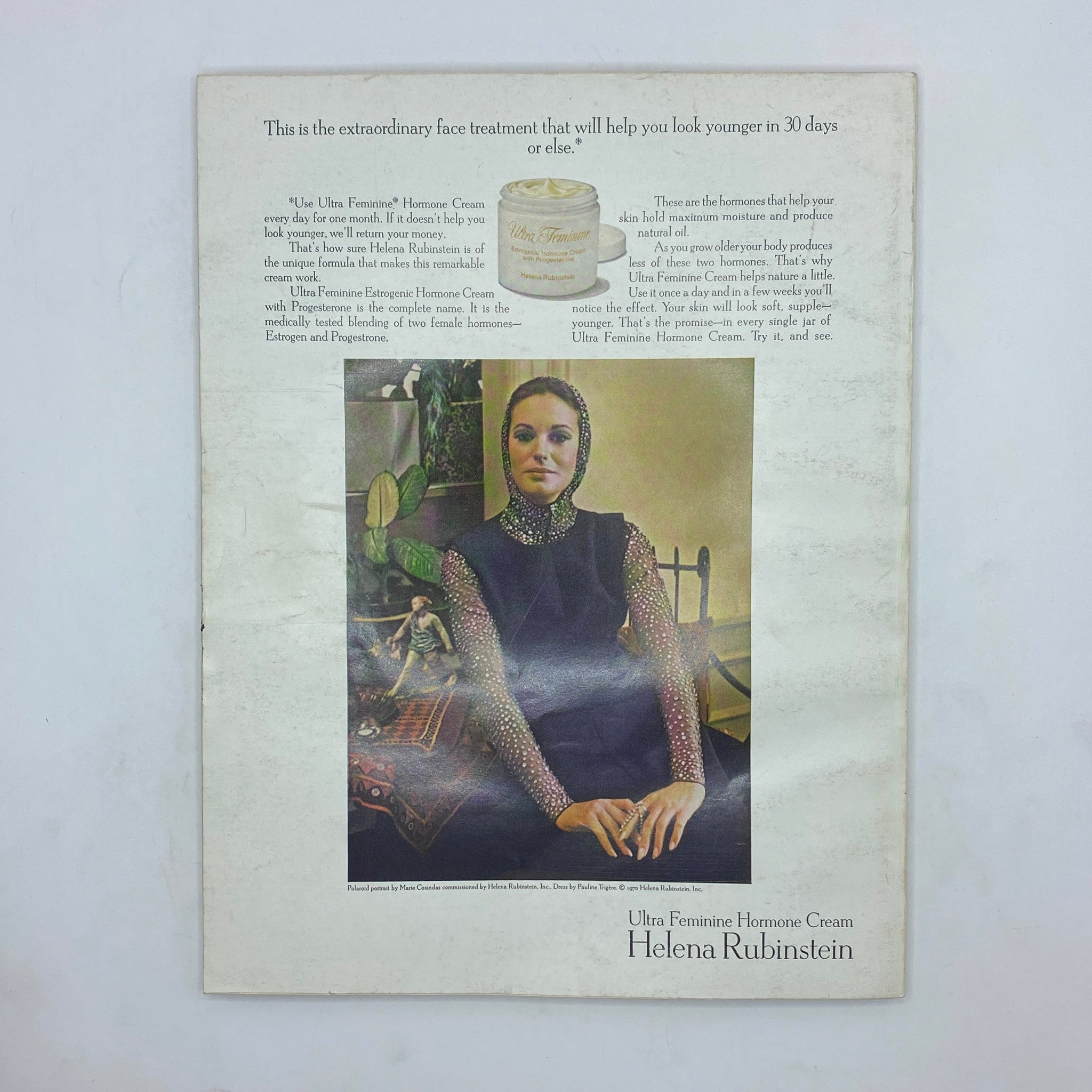 Advertisement from VTG Vogue Magazine March 1 1970 featuring Helena Rubinstein's Ultra Feminine Hormone Cream, illustrating a woman in sophisticated attire sitting elegantly.