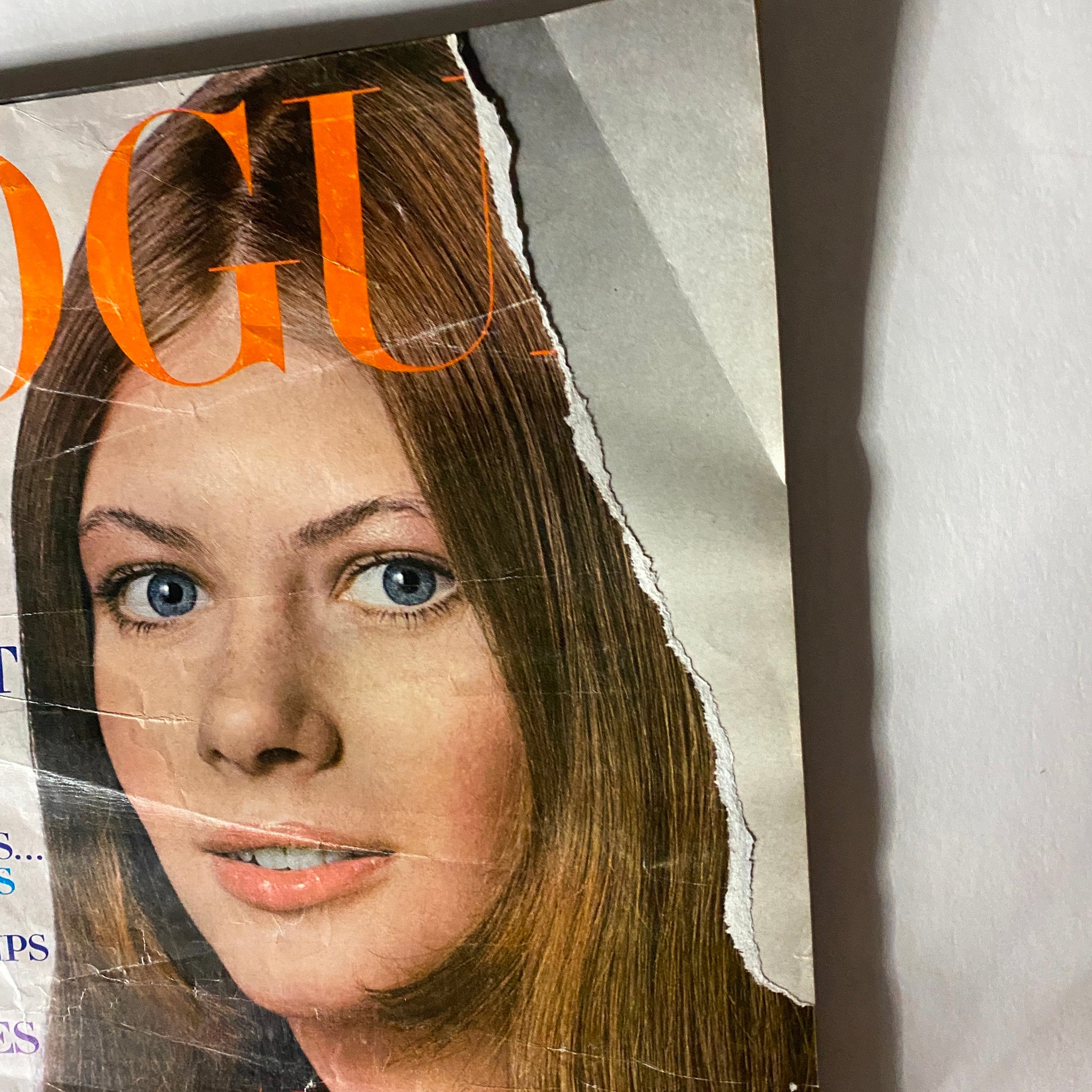 Cover of VTG Vogue Magazine January 15, 1970 featuring a model with long hair and blue eyes. Vintage style with visible wear and tear.
