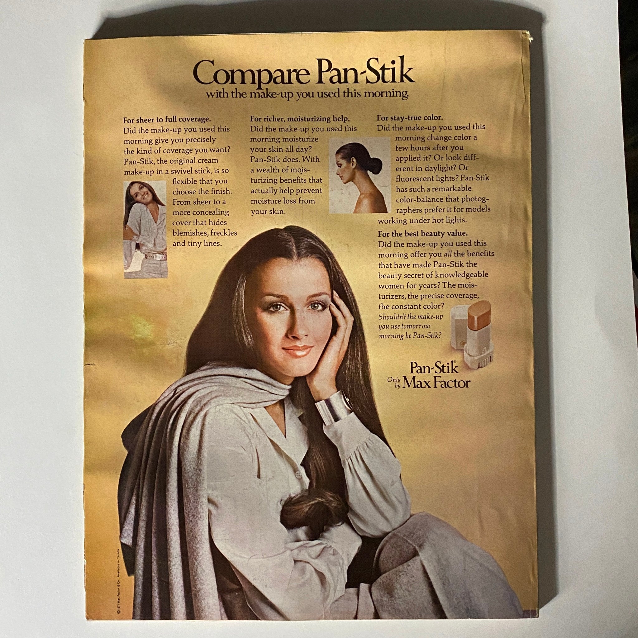 Vintage Vogue Magazine May 1971 advertisement for Pan-Stik makeup by Max Factor, featuring a model with long hair and a stylish outfit.