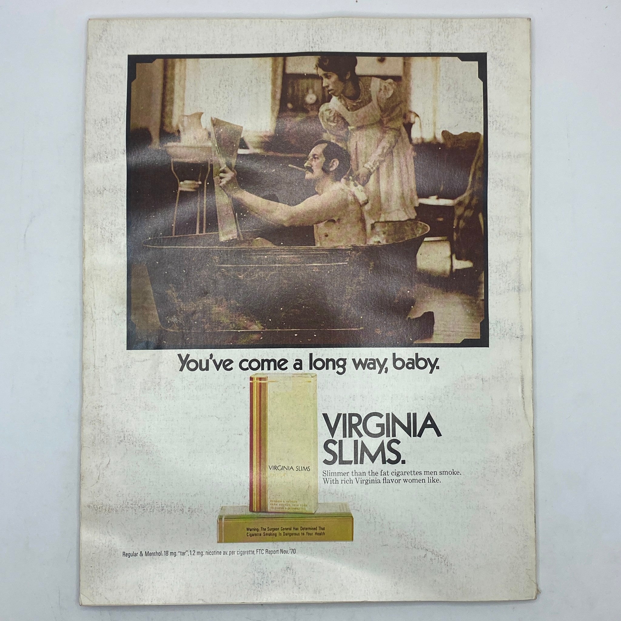 Vintage advertisement from VTG Vogue Magazine October 15 1971 for Virginia Slims cigarettes, featuring an evocative photo and slogan.